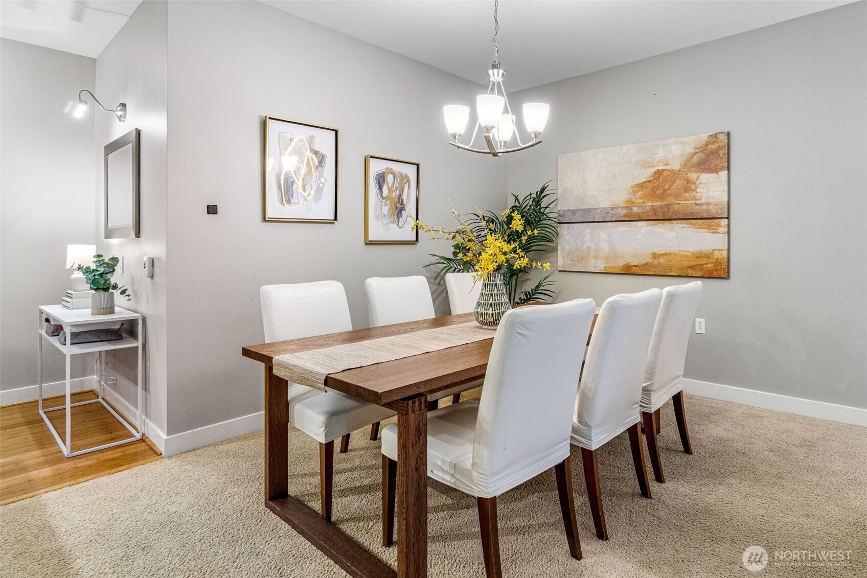 15700 116th Avenue Northeast, Unit 102A Bothell, WA 98011 - Photo 8 of 35 a view of a dining room with furniture and chandelier