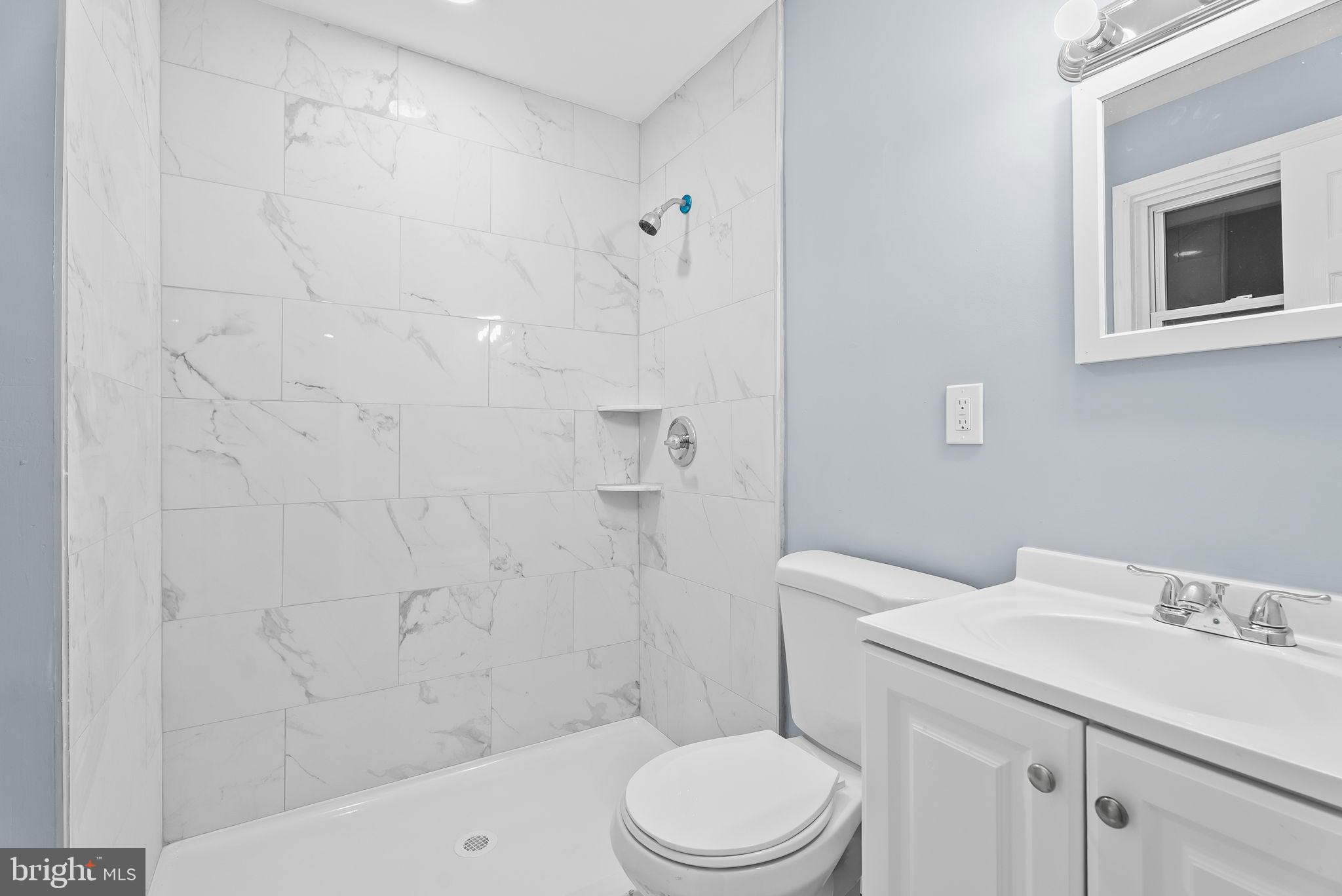 4302 Henderson Road Temple Hills, MD 20748 - Photo 19 of 33 Modern bathroom with elegant marble tiles.