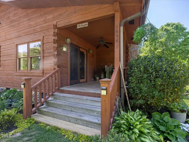 a view of walk in closet with clothes