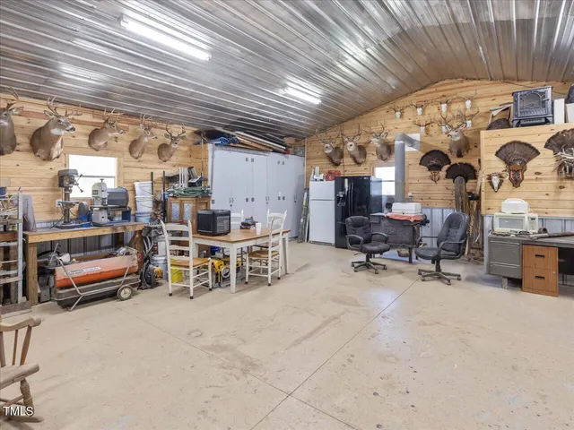 an aerial view of a house with garden space and street view