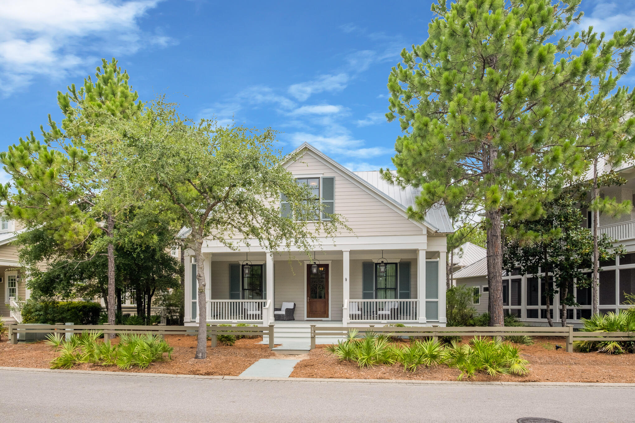 296 Pine Needle Way Santa Rosa Beach, FL 32459 - Photo 14 of 61 a front view of a house with garden