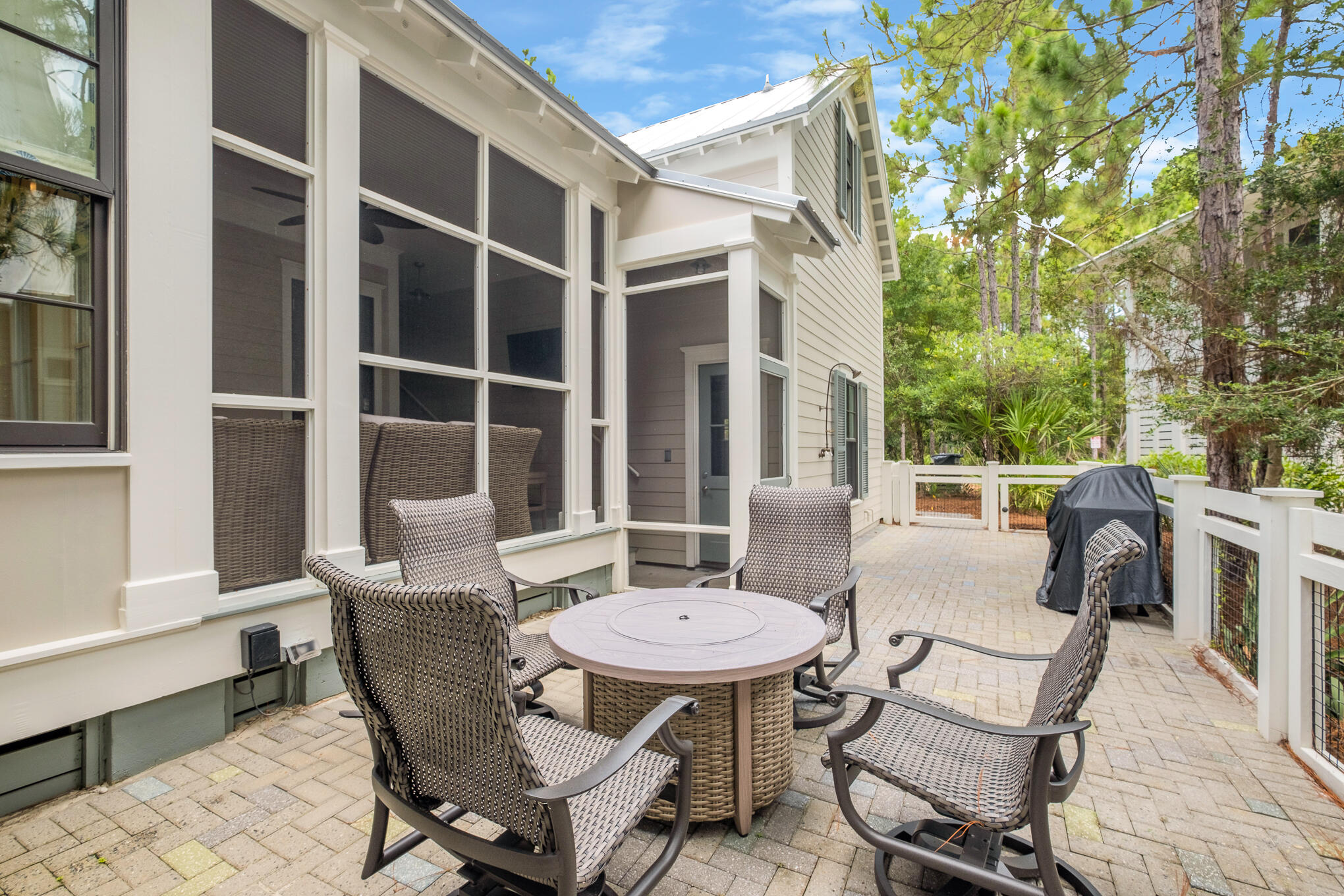 296 Pine Needle Way Santa Rosa Beach, FL 32459 - Photo 21 of 61 a view of a patio with table and chairs and potted plants