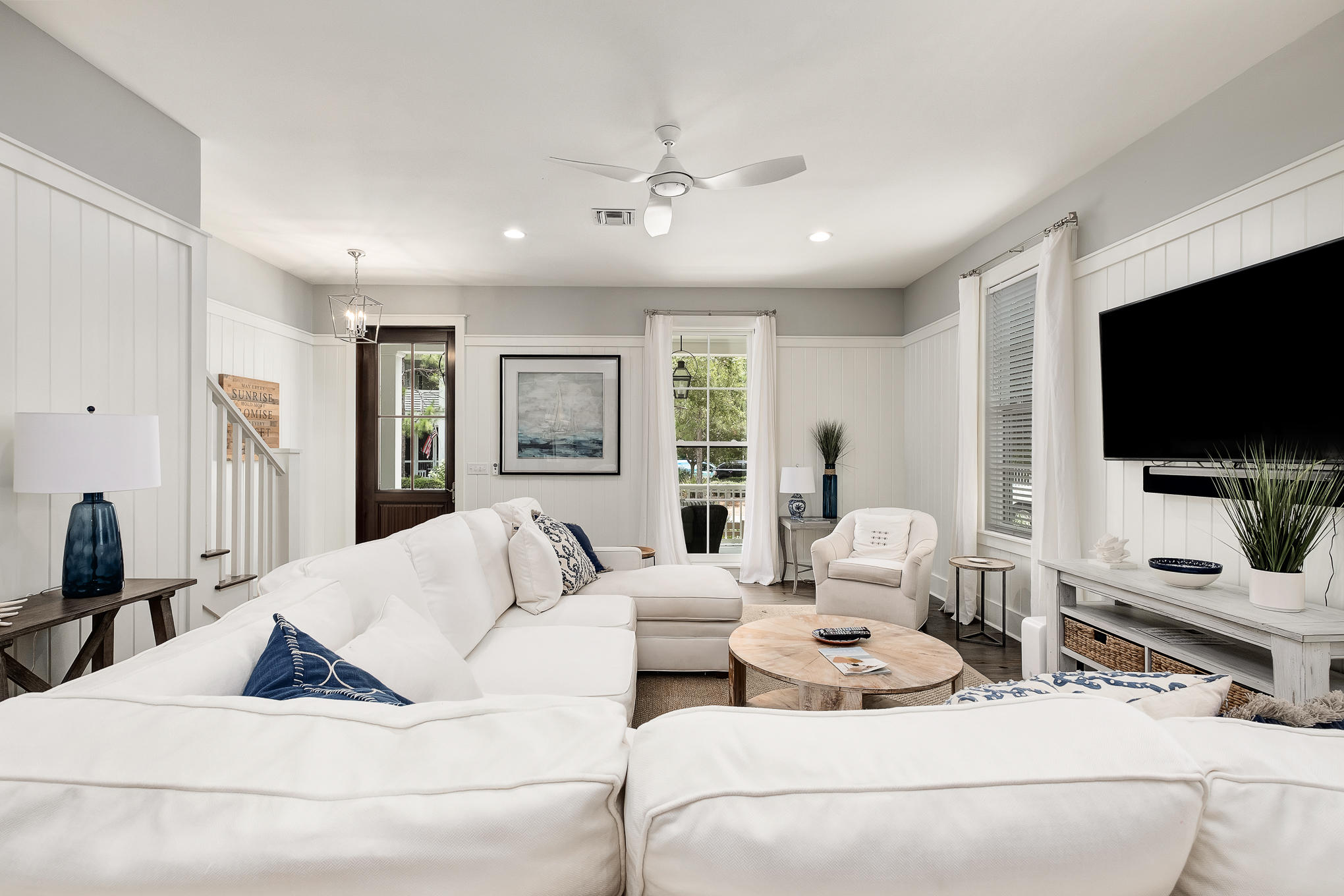 296 Pine Needle Way Santa Rosa Beach, FL 32459 - Photo 29 of 61 a living room with furniture and a flat screen tv