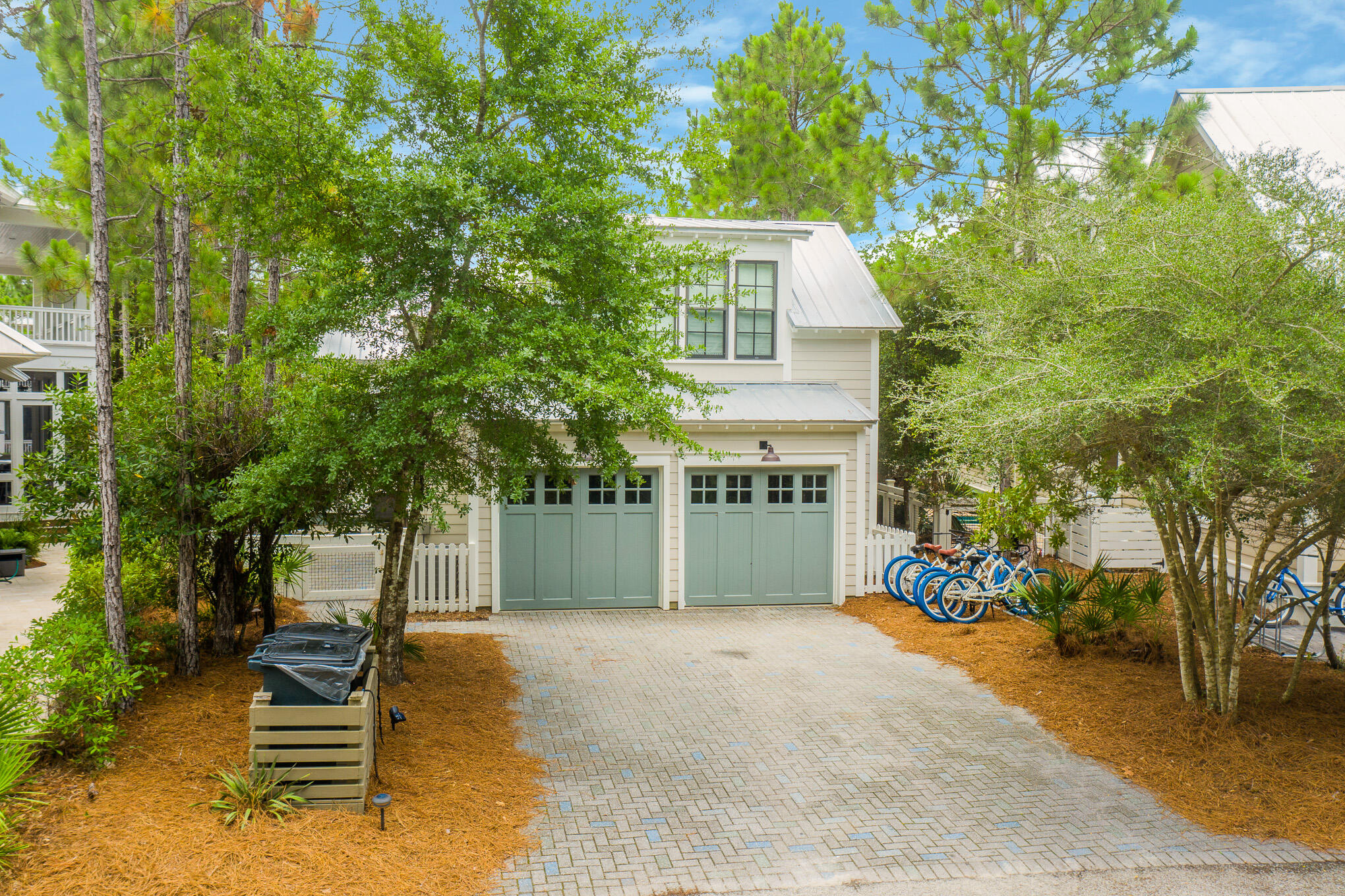 296 Pine Needle Way Santa Rosa Beach, FL 32459 - Photo 4 of 61 a front view of a house with garden
