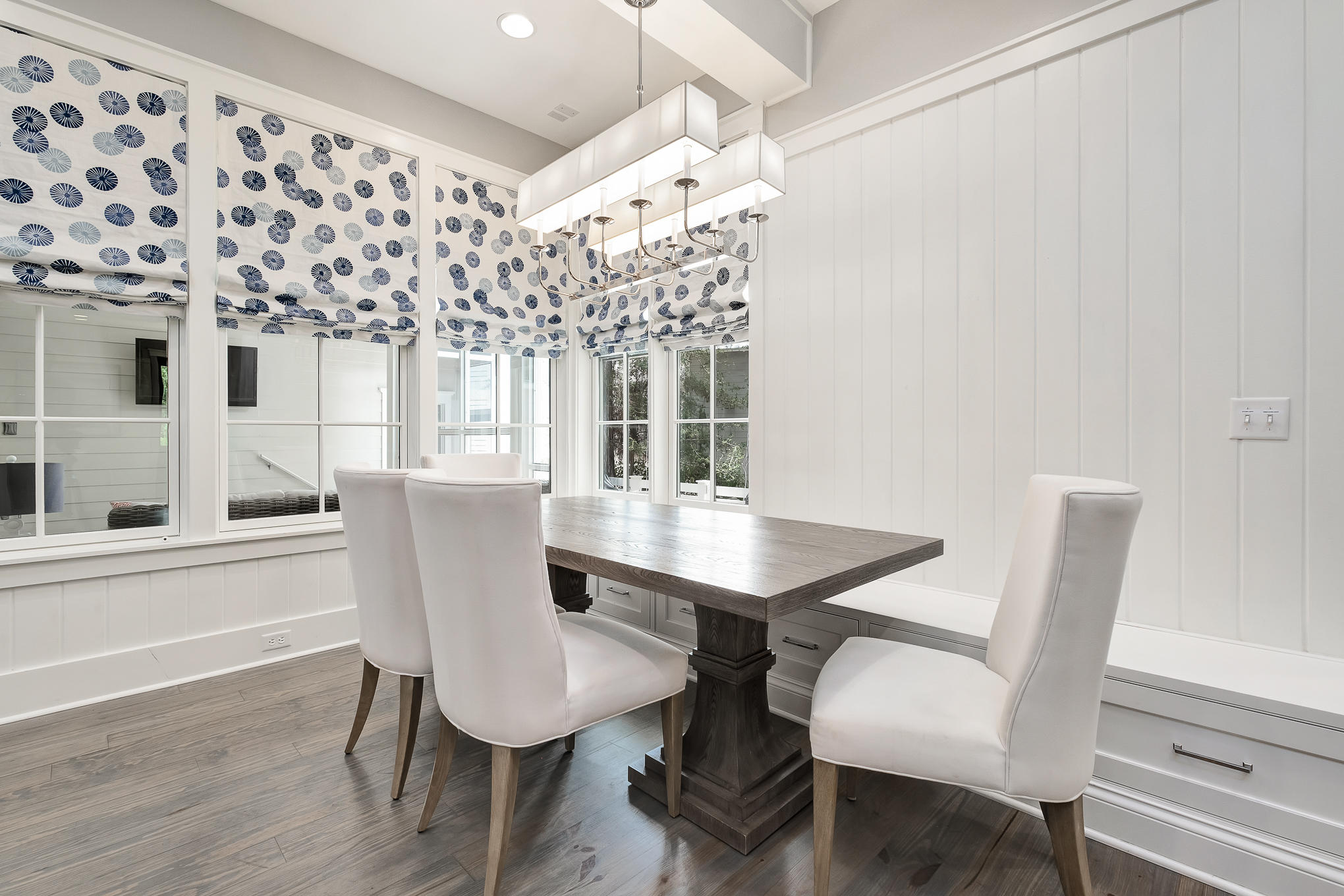 296 Pine Needle Way Santa Rosa Beach, FL 32459 - Photo 32 of 61 a view of a dining room with furniture and wooden floor