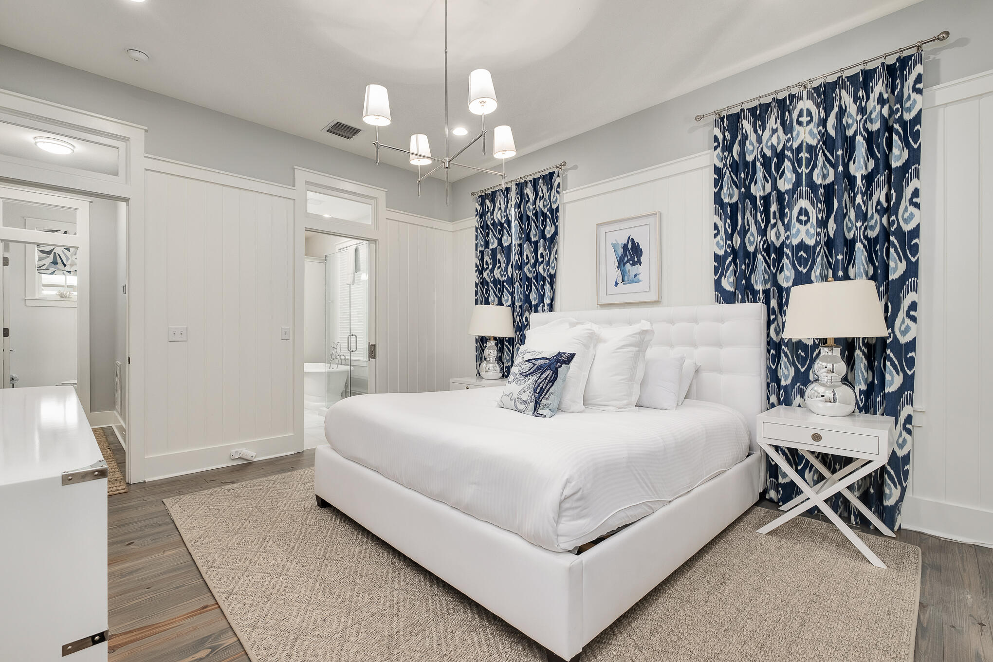 296 Pine Needle Way Santa Rosa Beach, FL 32459 - Photo 37 of 61 a bedroom with a large bed and a chandelier