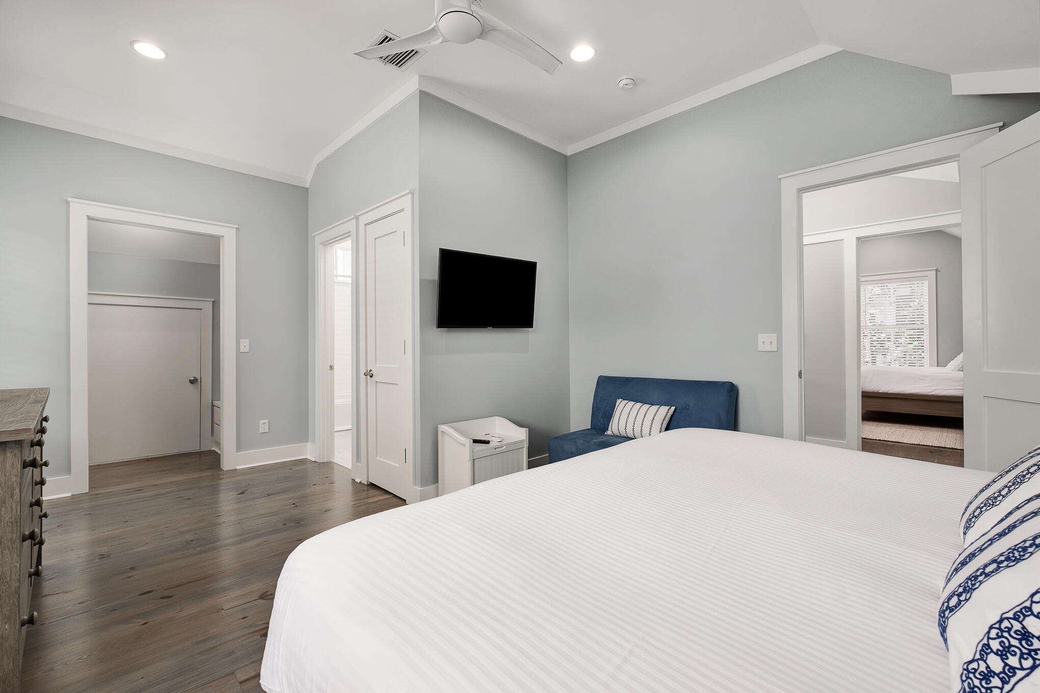 296 Pine Needle Way Santa Rosa Beach, FL 32459 - Photo 43 of 61 a bedroom with a bed and a flat tv screen on wall