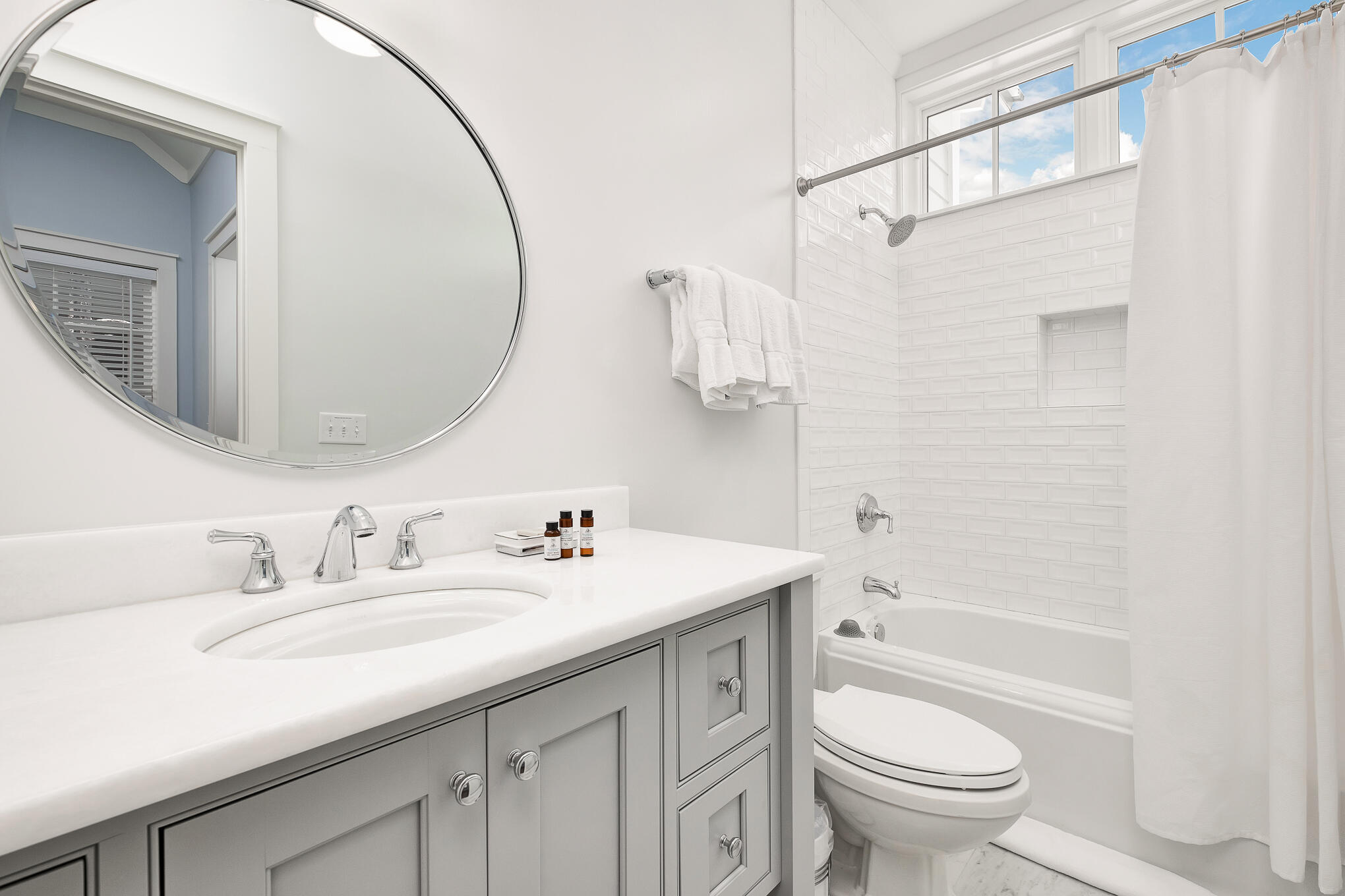 296 Pine Needle Way Santa Rosa Beach, FL 32459 - Photo 47 of 61 a bathroom with a sink a toilet and a mirror