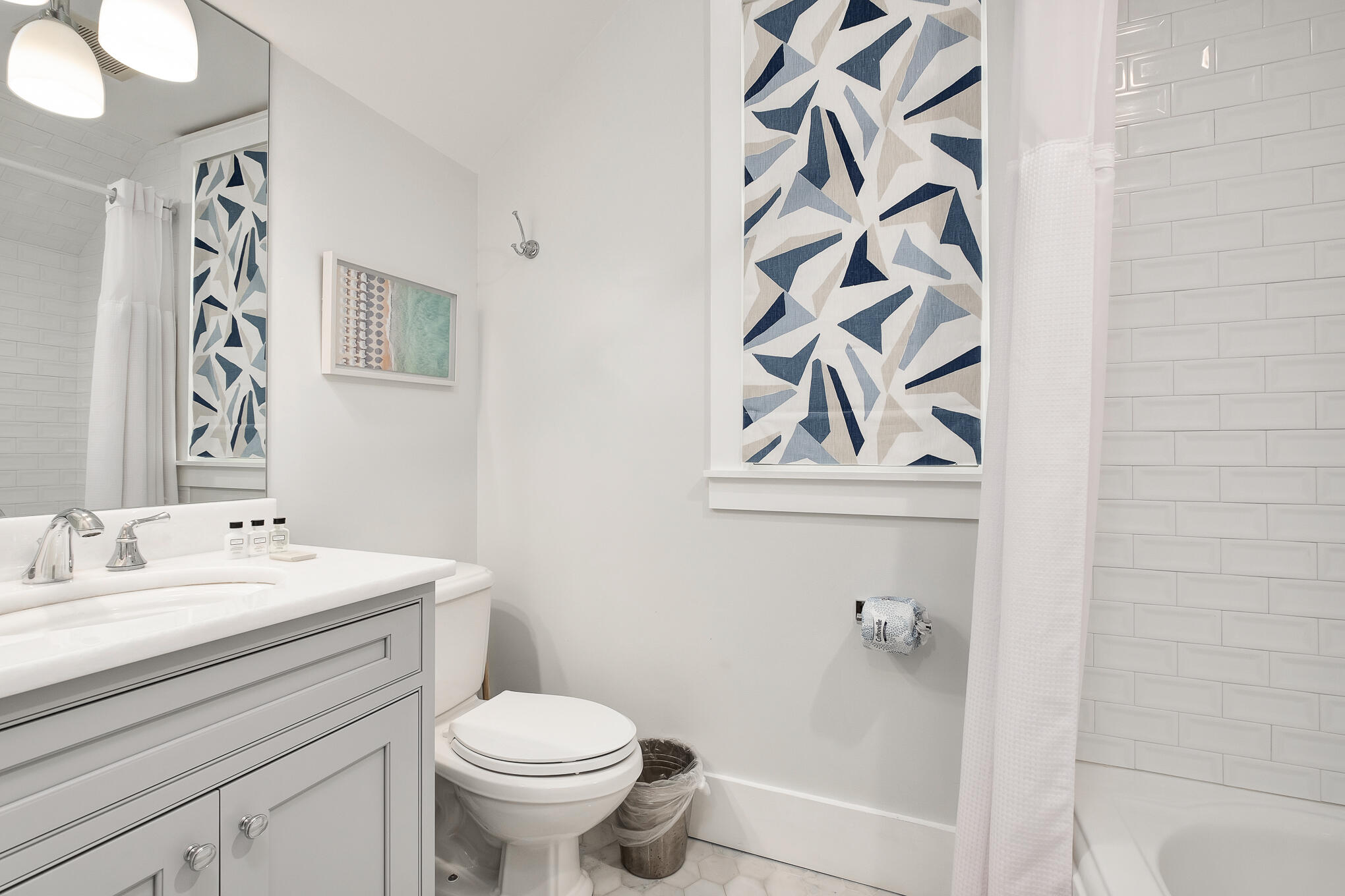 296 Pine Needle Way Santa Rosa Beach, FL 32459 - Photo 51 of 61 a bathroom with a toilet sink and mirror