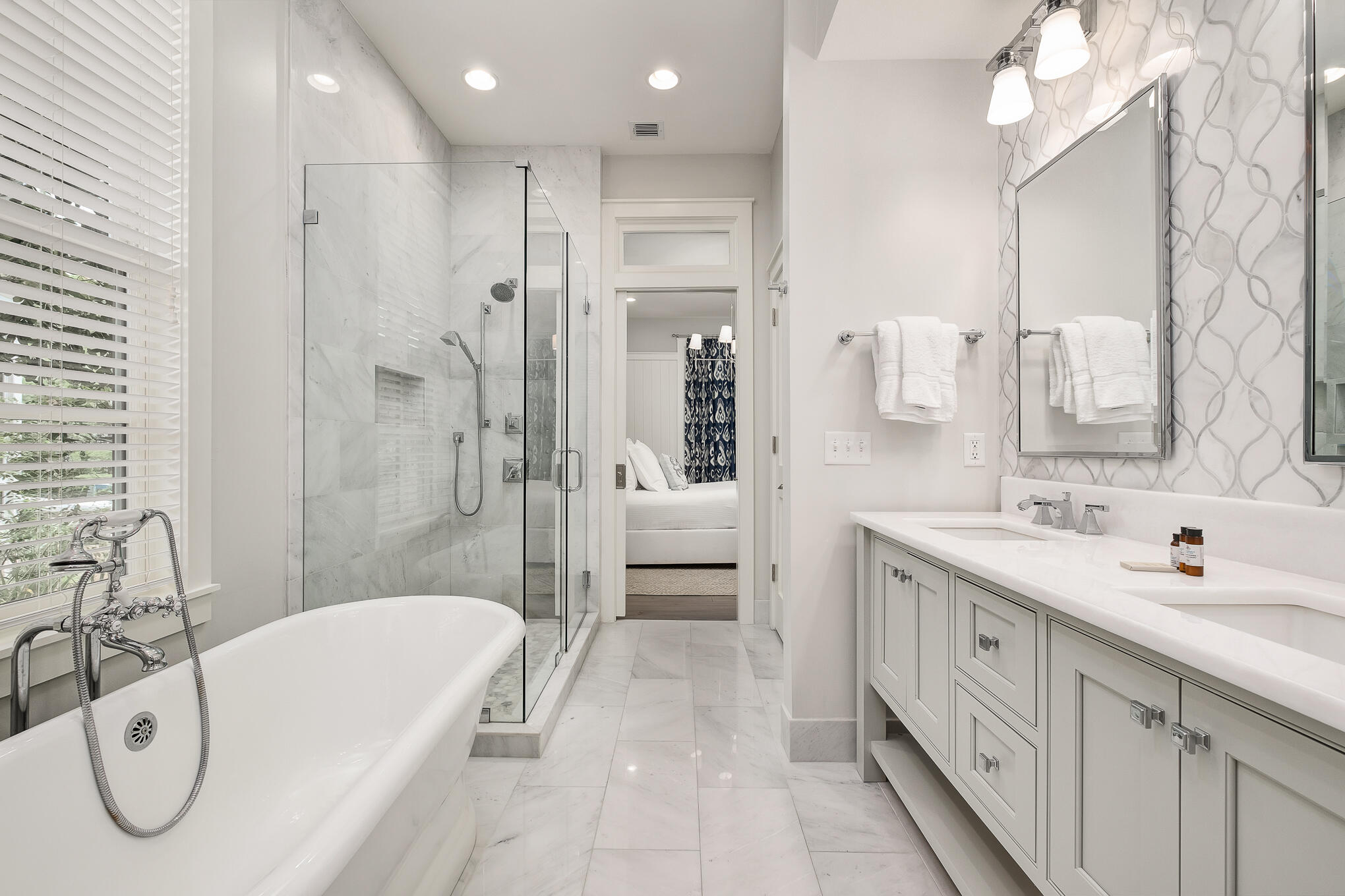 296 Pine Needle Way Santa Rosa Beach, FL 32459 - Photo 8 of 61 a en suite bathroom with a double vanity sink a mirror and a bathtub