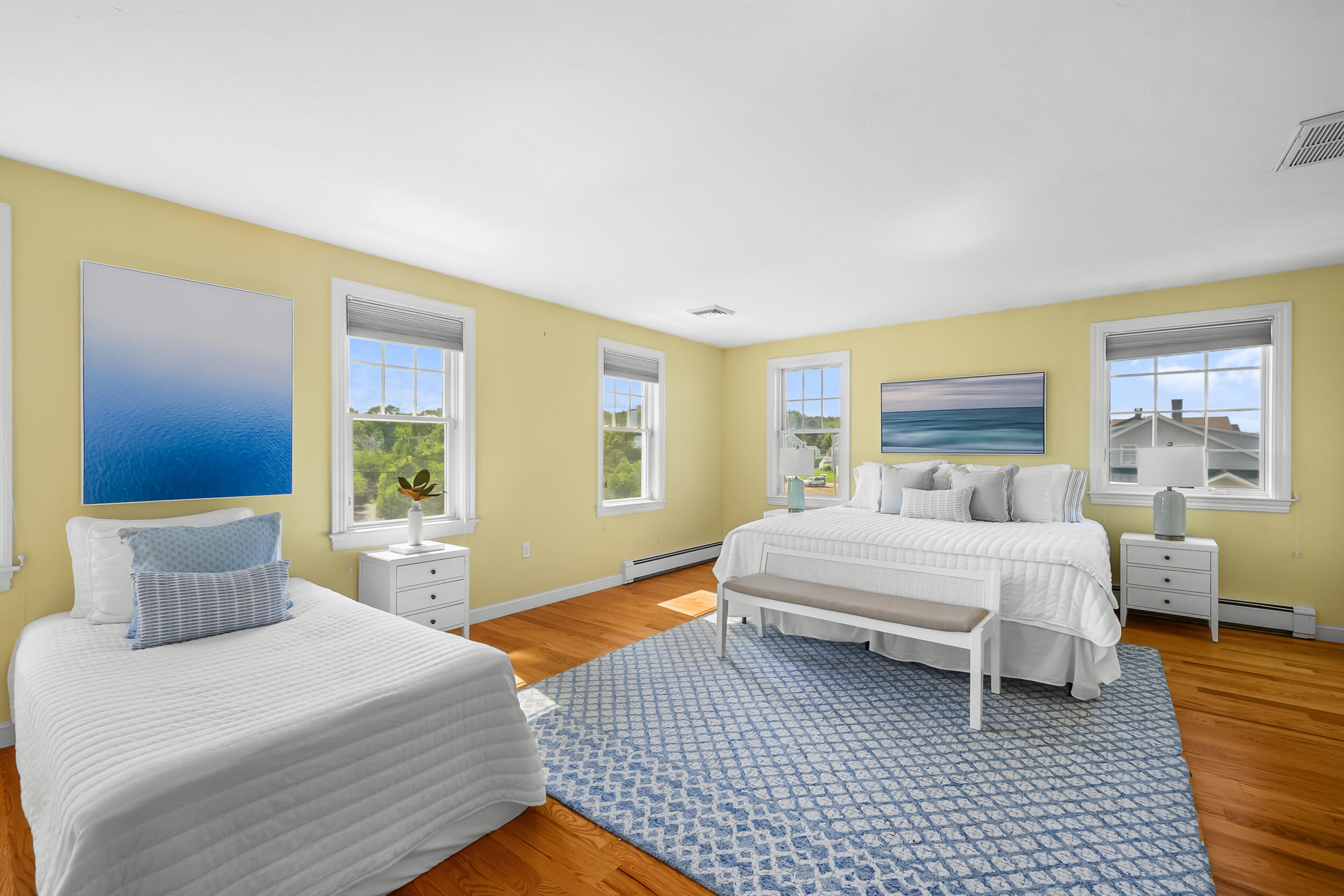 67 Phillips Road Sagamore Beach, MA 02562 - Photo 19 of 43 a spacious bedroom with a bed and wooden floor