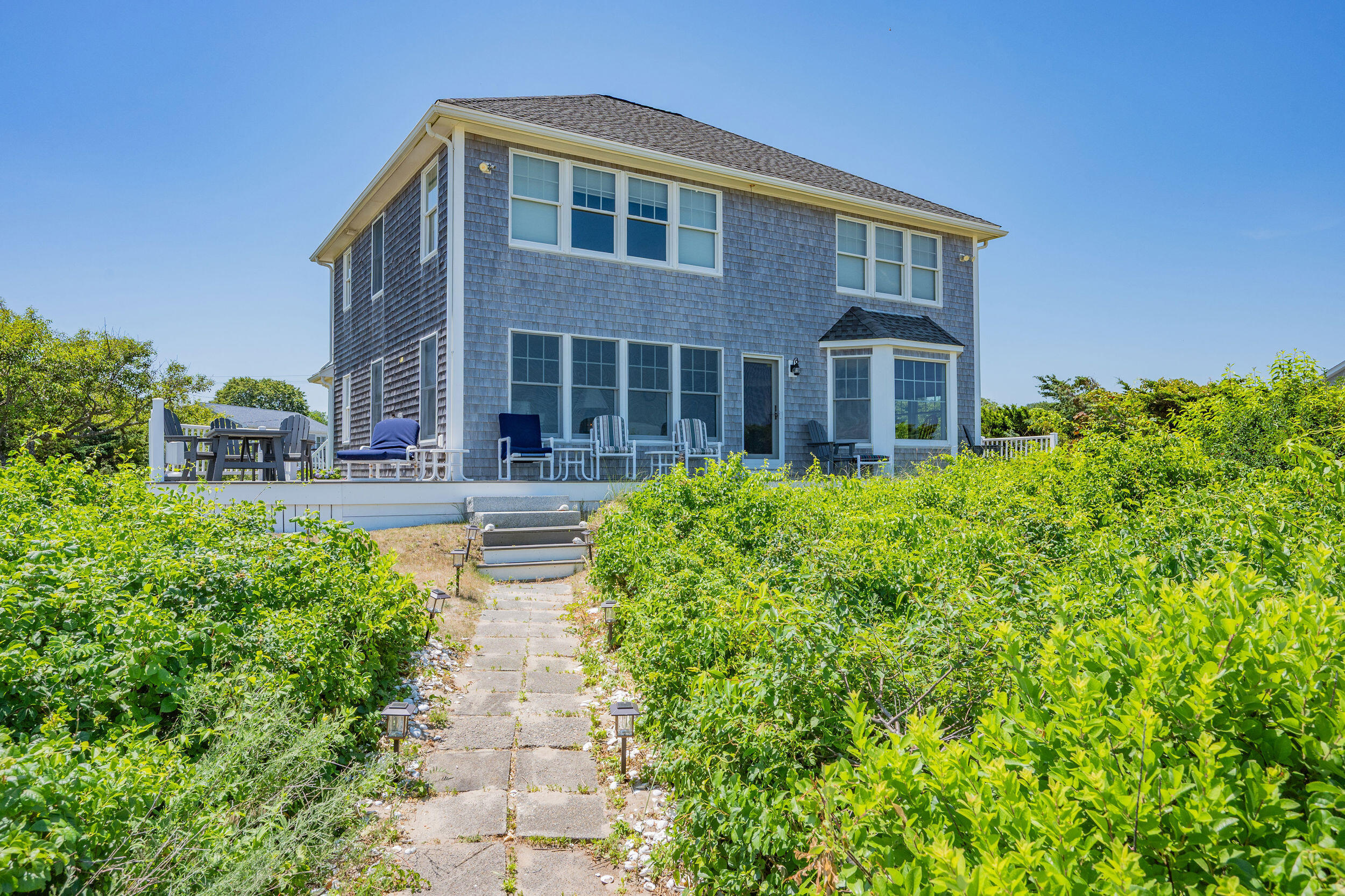 67 Phillips Road Sagamore Beach, MA 02562 - Photo 32 of 43 a front view of house with yard and green space
