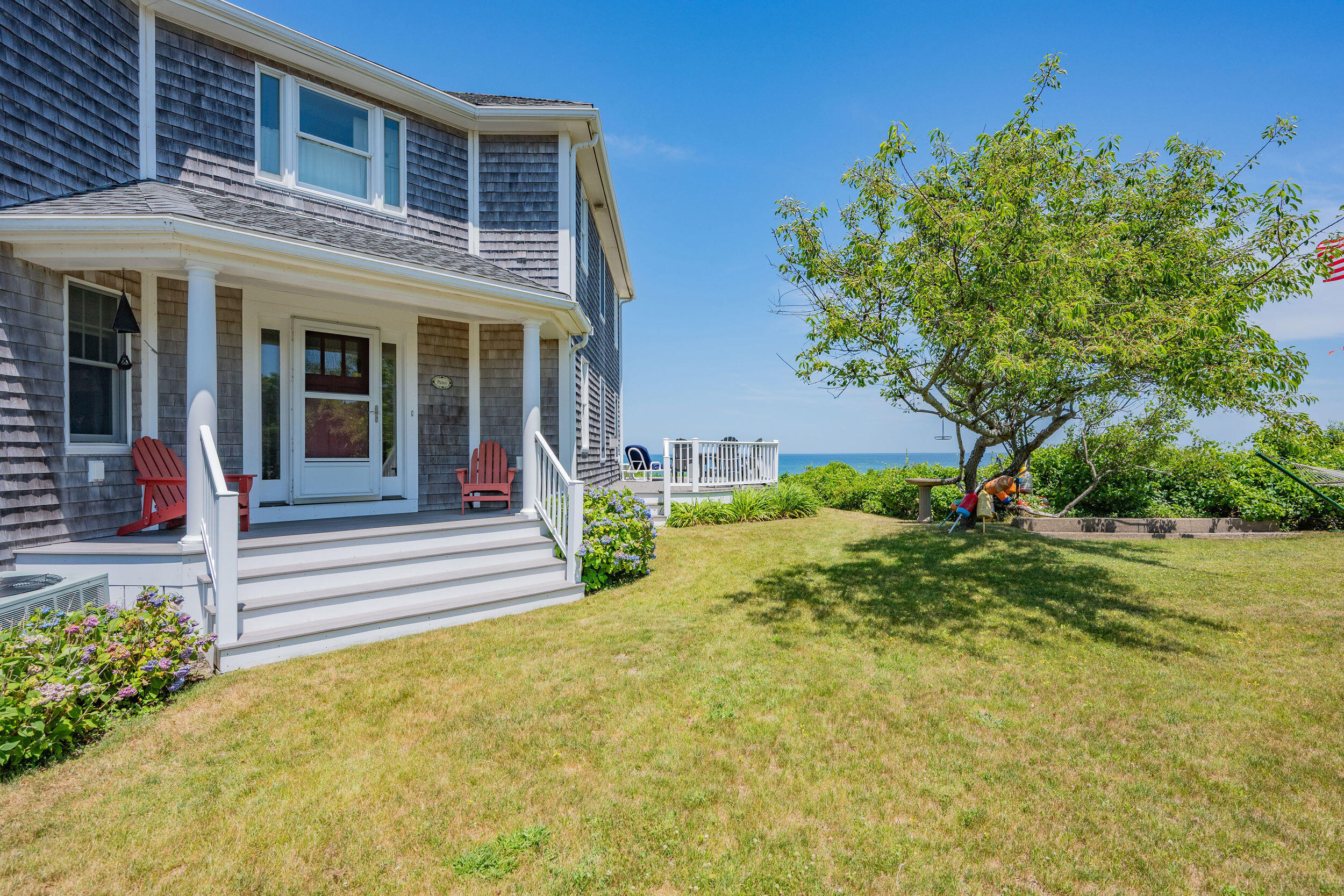 67 Phillips Road Sagamore Beach, MA 02562 - Photo 33 of 43 a front view of a house with garden