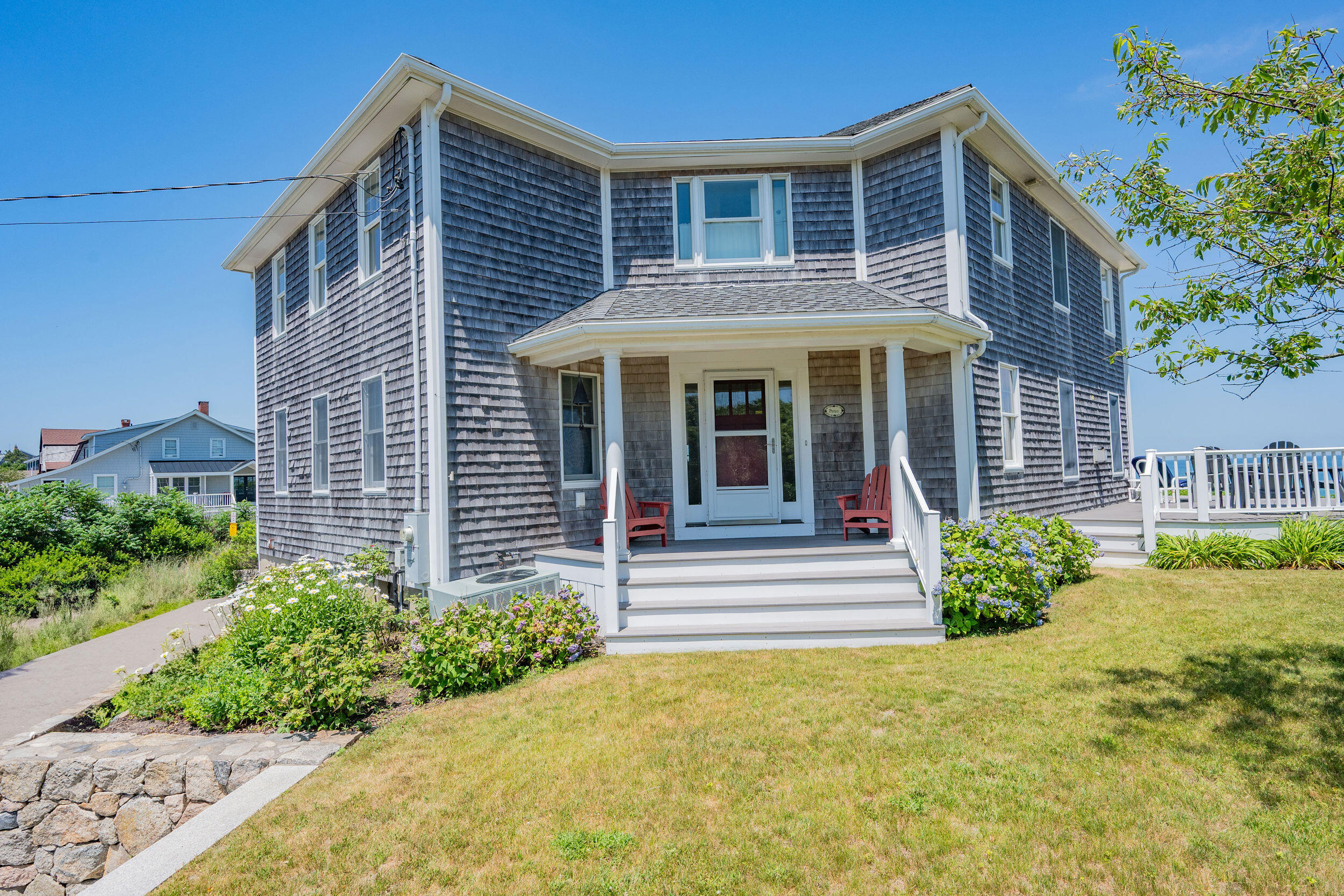 67 Phillips Road Sagamore Beach, MA 02562 - Photo 34 of 43 a front view of a house with garden