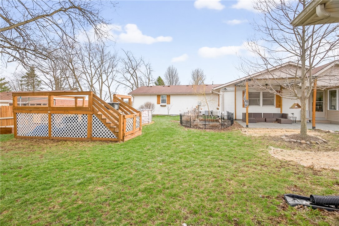 7888 Darke-Preble County Line Road Arcanum, OH 45304 - Photo 43 of 51 This spacious backyard features a multi-level deck and a charming patio area, perfect for outdoor enjoyment.