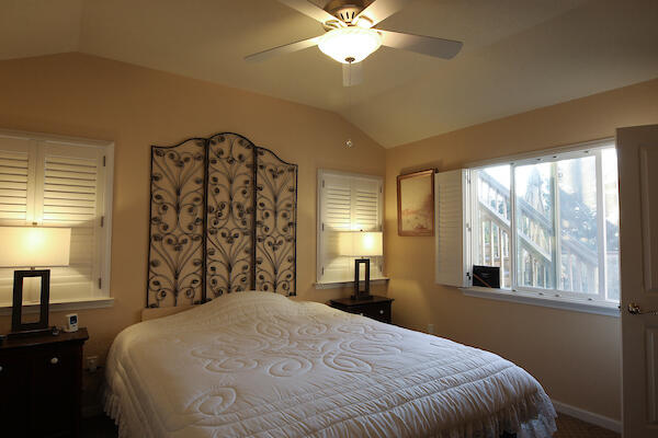 1050 Spring Road Shelter Cove, CA 95589 - Photo 27 of 42 a bedroom with a bed and a chandelier