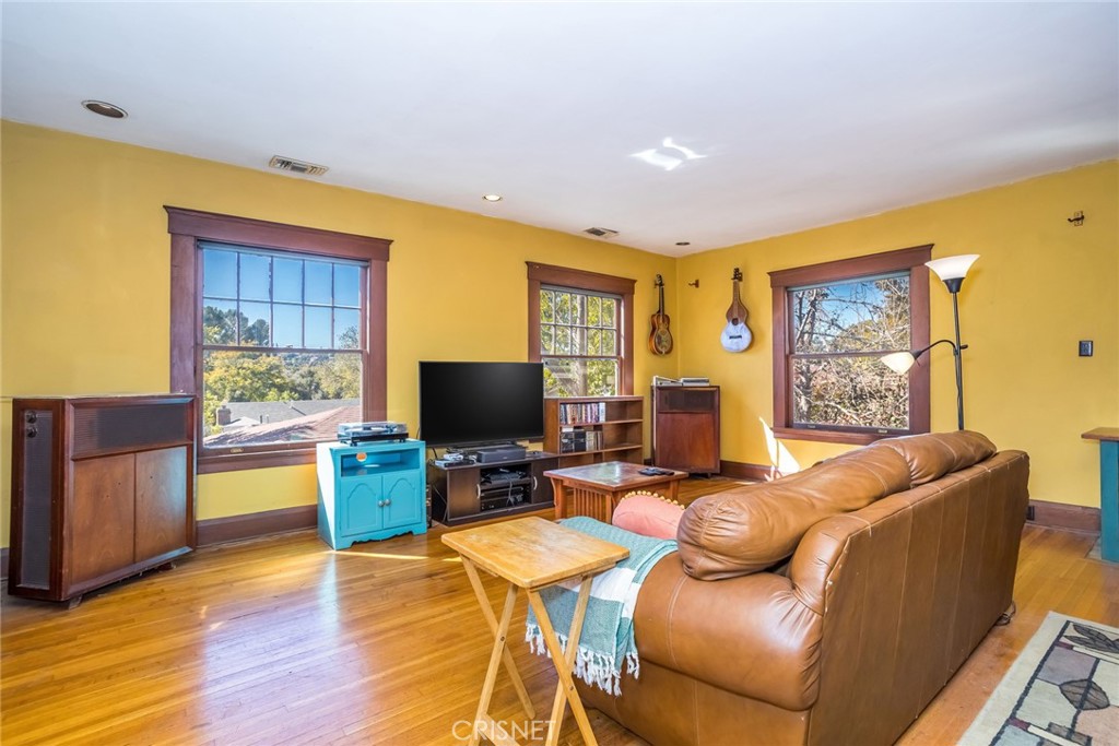 5289 Ellenwood Drive Eagle Rock, CA 90041 - Photo 24 of 28 a living room with furniture and a flat screen tv
