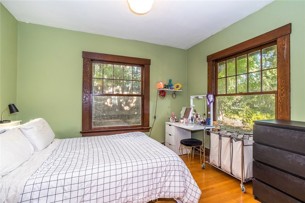 5289 Ellenwood Drive Eagle Rock, CA 90041 - Photo 8 of 28 a bedroom with a bed and large windows