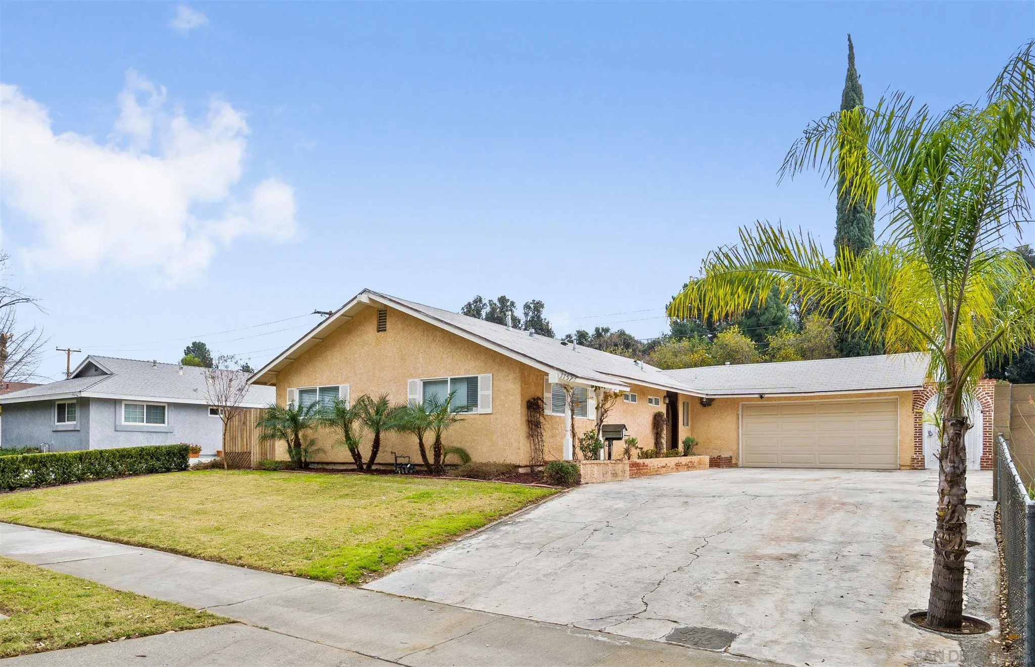 7752 Bayberry Avenue Riverside, CA 92504 - Photo 1 of 27 a front view of a house with a yard and garage
