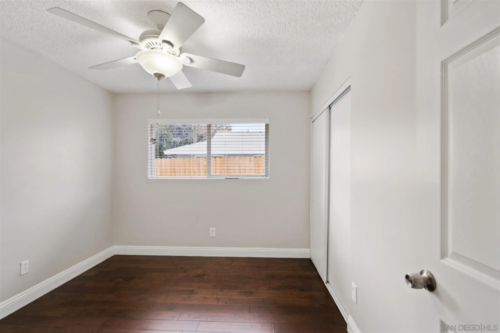 7752 Bayberry Avenue Riverside, CA 92504 - Photo 19 of 27 an empty room with wooden floor and window