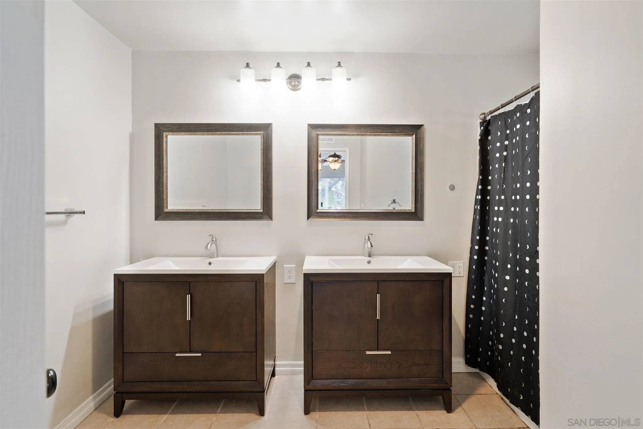 7752 Bayberry Avenue Riverside, CA 92504 - Photo 20 of 27 a bathroom with double sink and mirror