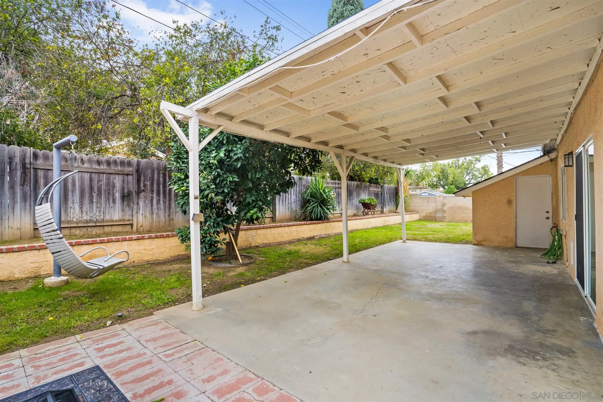 7752 Bayberry Avenue Riverside, CA 92504 - Photo 24 of 27 a view of a backyard with a small cabin and wooden fence