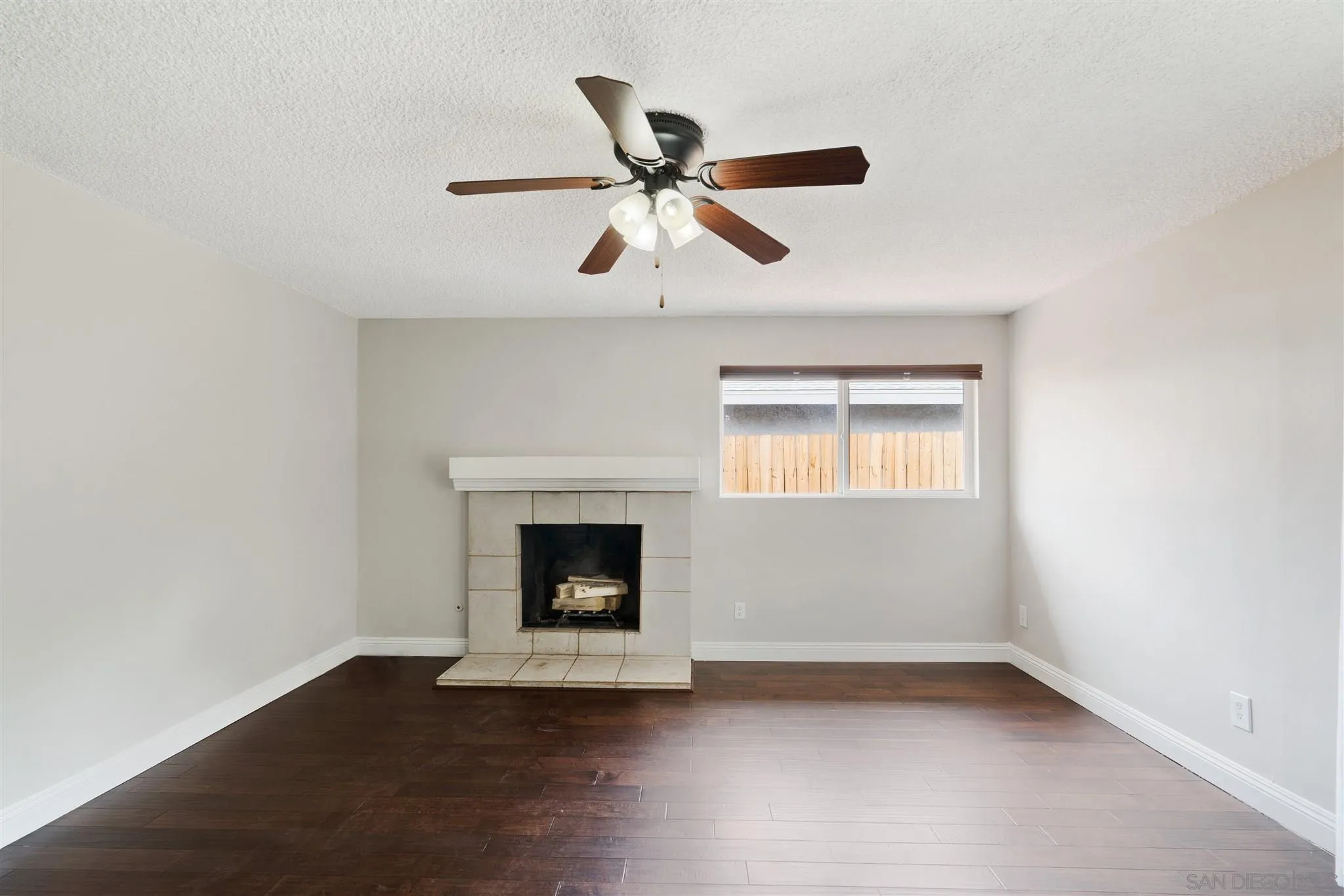 7752 Bayberry Avenue Riverside, CA 92504 - Photo 8 of 27 a view of an empty room with wooden floor and a window