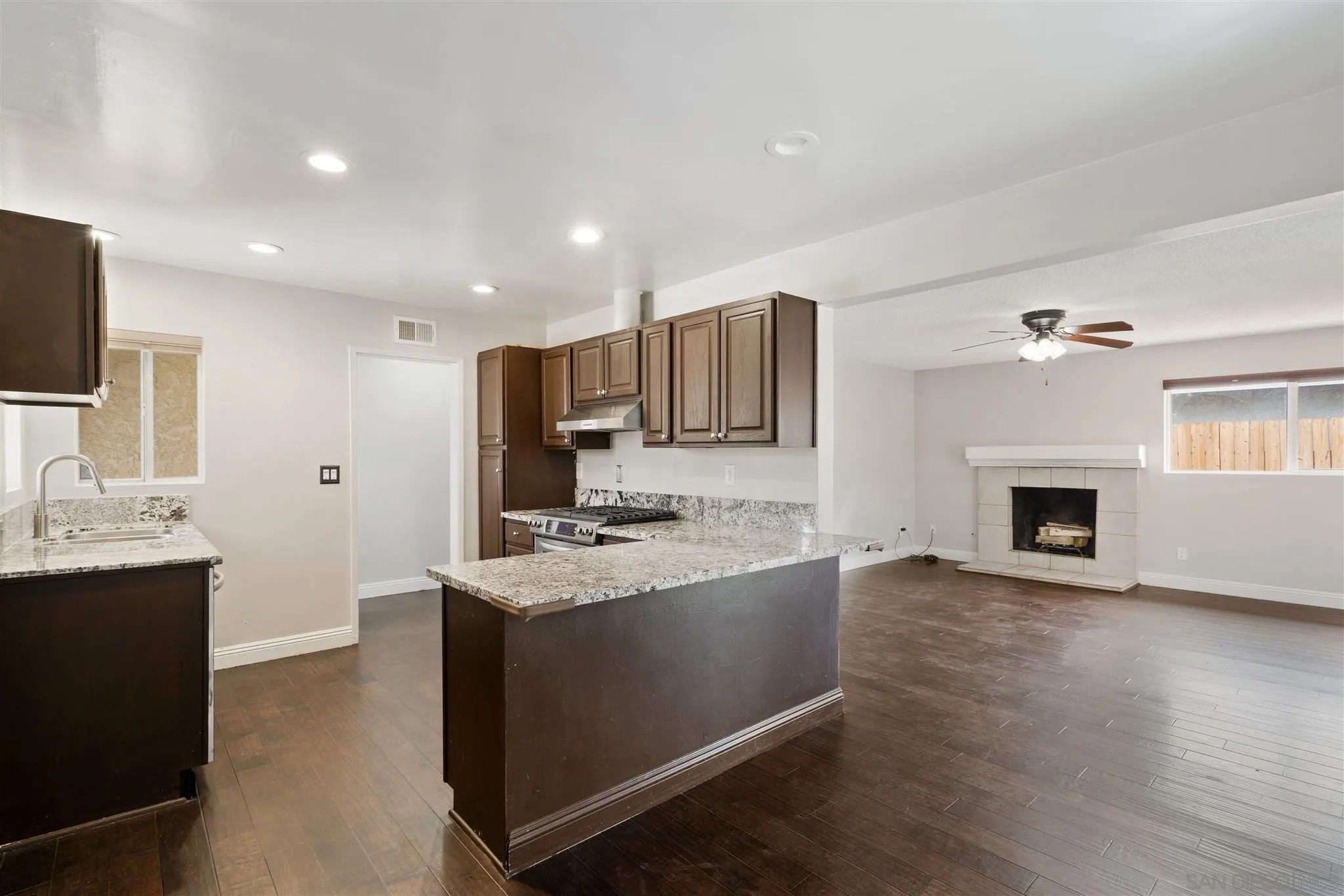 7752 Bayberry Avenue Riverside, CA 92504 - Photo 10 of 27 a kitchen with stainless steel appliances granite countertop a sink stove and refrigerator
