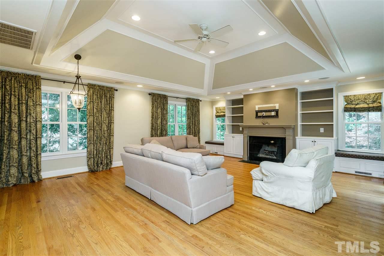 512 Burton Street Raleigh, NC 27608 - Photo 12 of 24 a living room with furniture and a fireplace