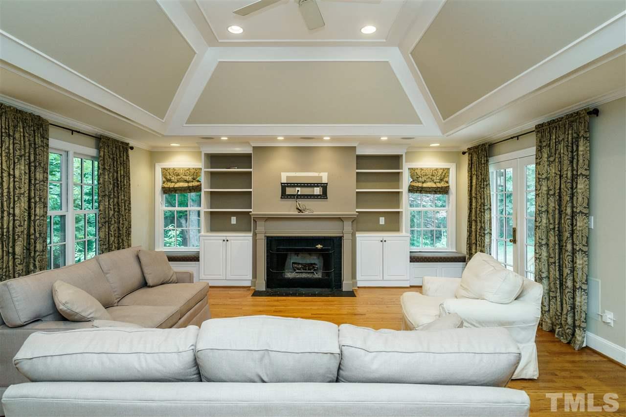 512 Burton Street Raleigh, NC 27608 - Photo 13 of 24 a living room with furniture and a fireplace