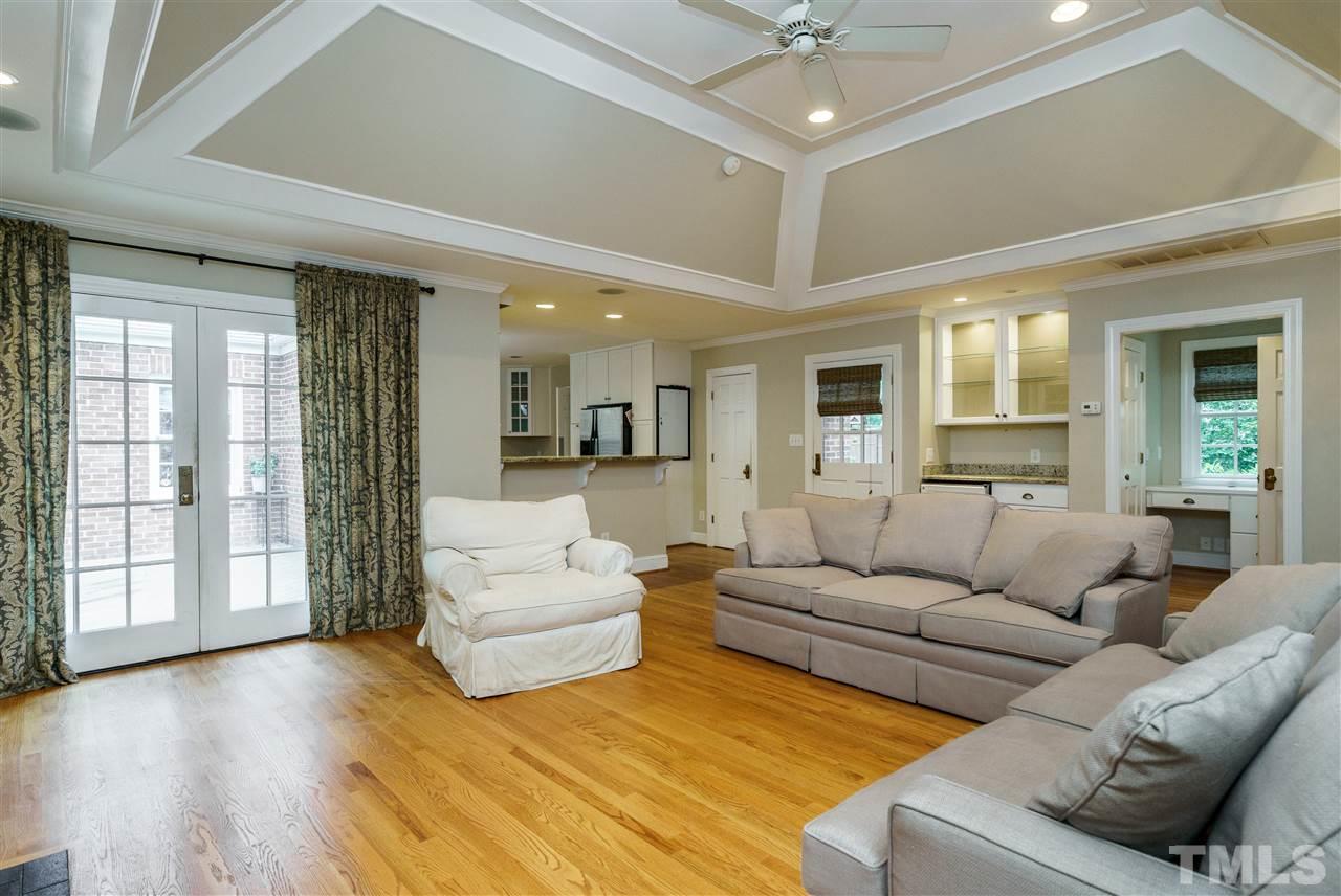 512 Burton Street Raleigh, NC 27608 - Photo 14 of 24 a living room with furniture and a large window