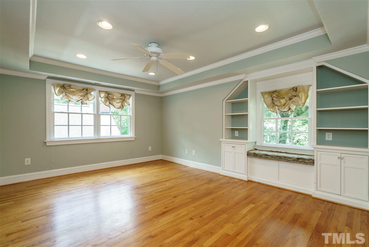 512 Burton Street Raleigh, NC 27608 - Photo 15 of 24 a view of an empty room with a window and wooden floor