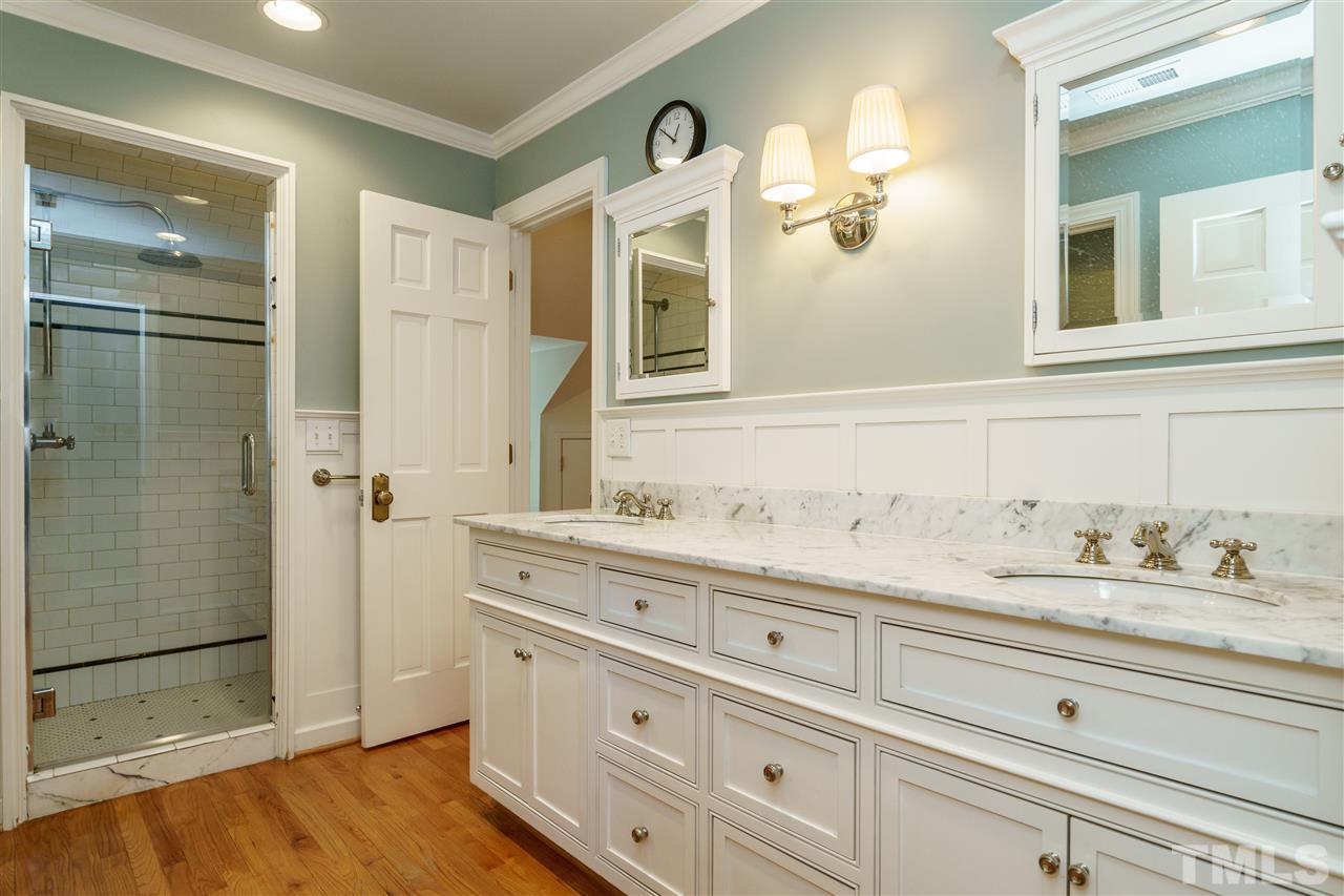 512 Burton Street Raleigh, NC 27608 - Photo 16 of 24 a bathroom with a granite countertop sink and a mirror