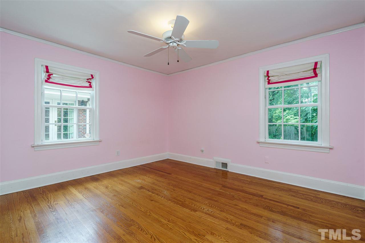 512 Burton Street Raleigh, NC 27608 - Photo 18 of 24 a view of an empty room with a window and wooden floor