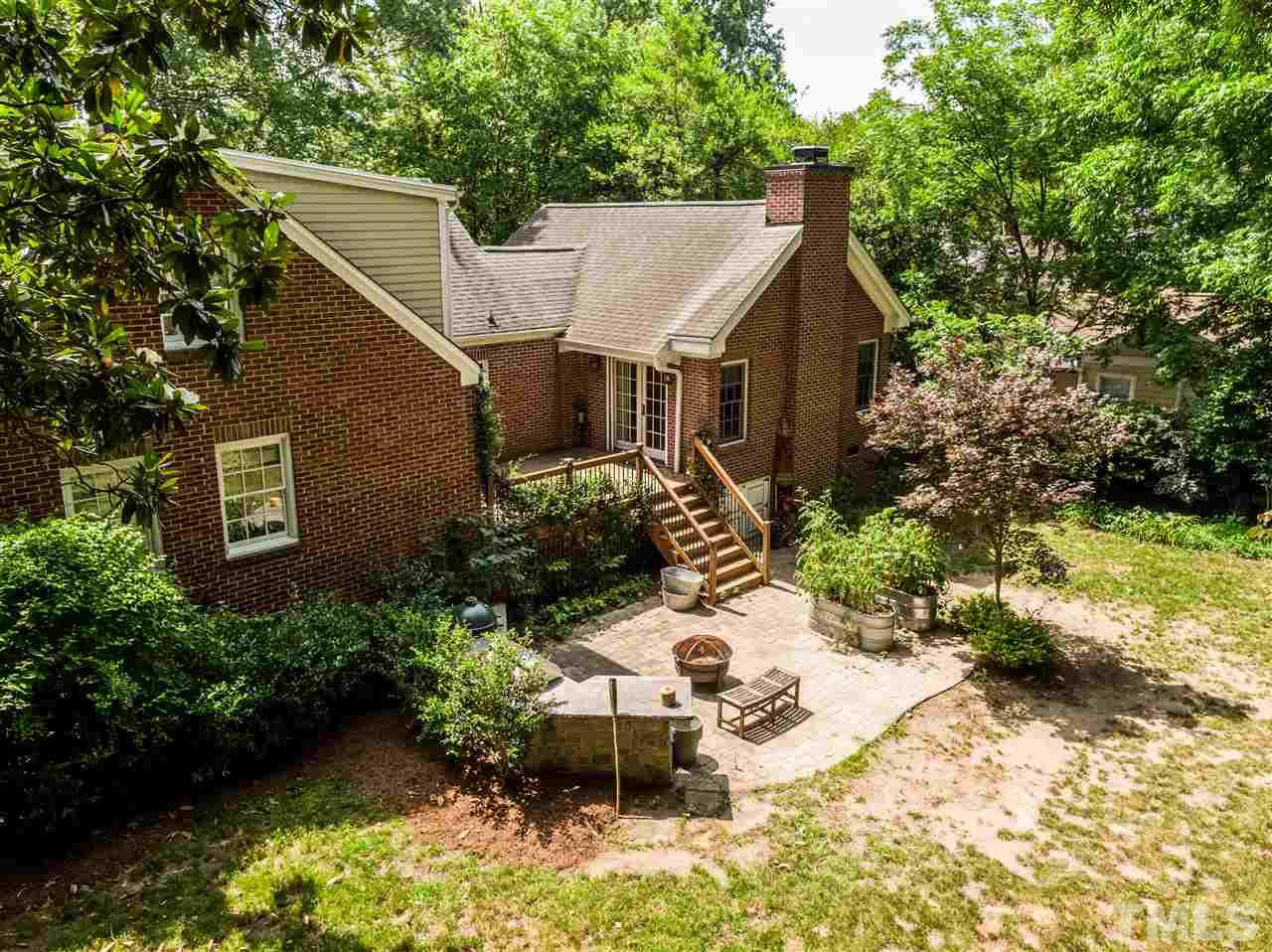 512 Burton Street Raleigh, NC 27608 - Photo 20 of 24 a view of a house with a yard
