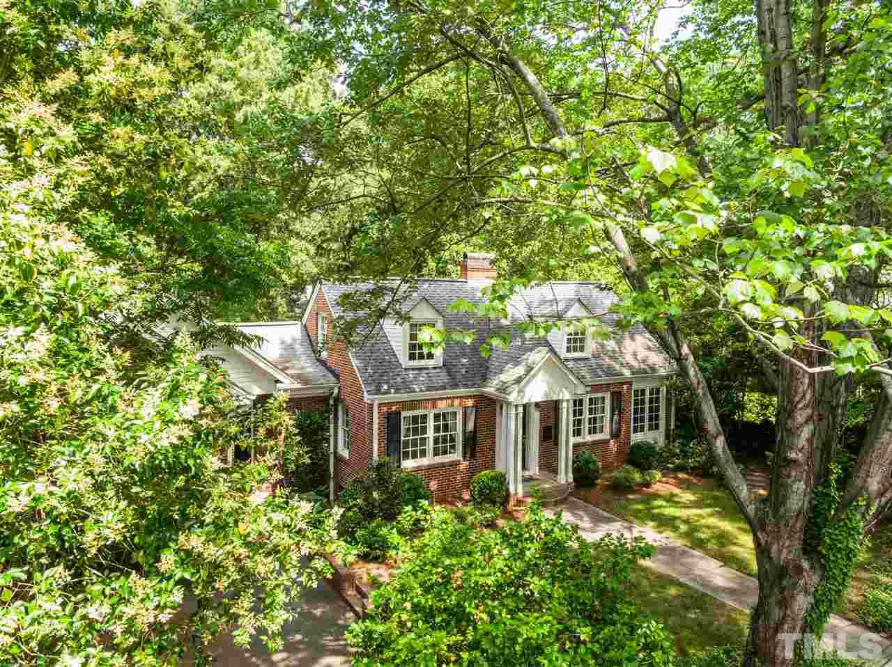 512 Burton Street Raleigh, NC 27608 - Photo 3 of 24 a front view of a house with a yard