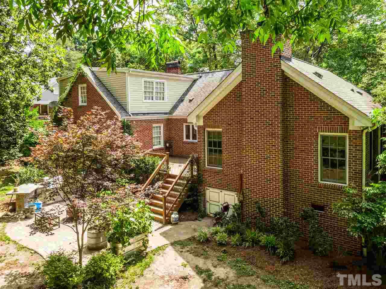 512 Burton Street Raleigh, NC 27608 - Photo 21 of 24 a front view of a house with garden