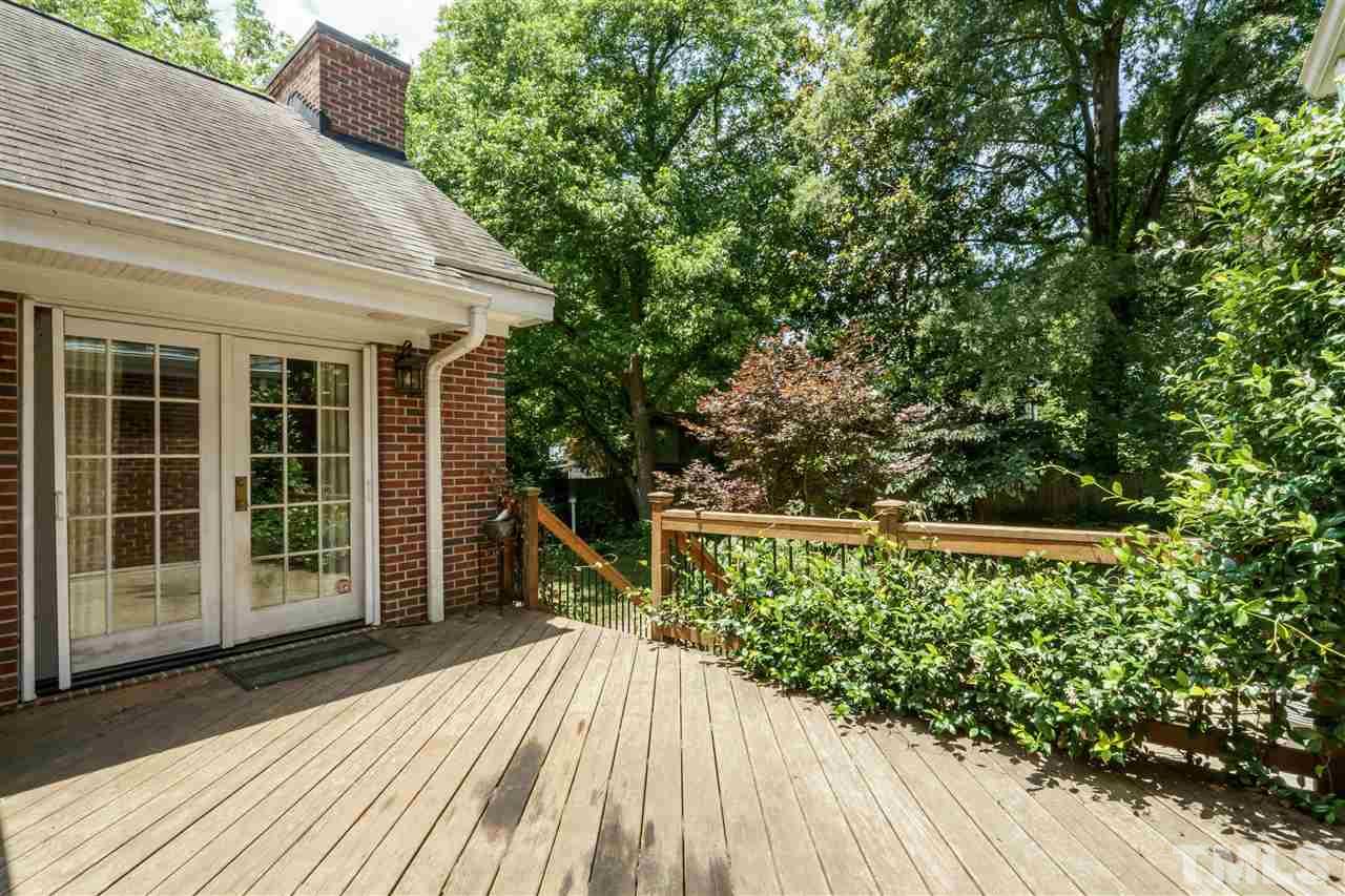 512 Burton Street Raleigh, NC 27608 - Photo 23 of 24 a balcony with wooden floor and outdoor space