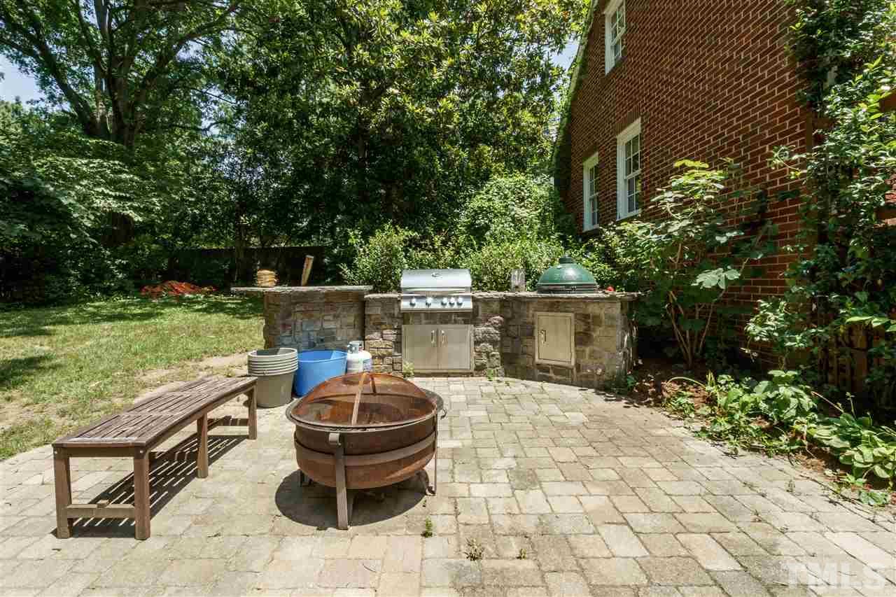 512 Burton Street Raleigh, NC 27608 - Photo 24 of 24 a view of a backyard with plants and outdoor seating