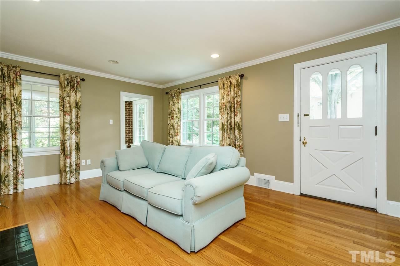 512 Burton Street Raleigh, NC 27608 - Photo 7 of 24 a living room with furniture and a large window