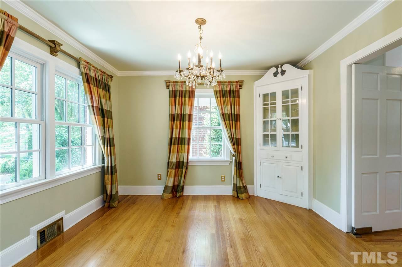 512 Burton Street Raleigh, NC 27608 - Photo 9 of 24 wooden floor in an empty room with a window