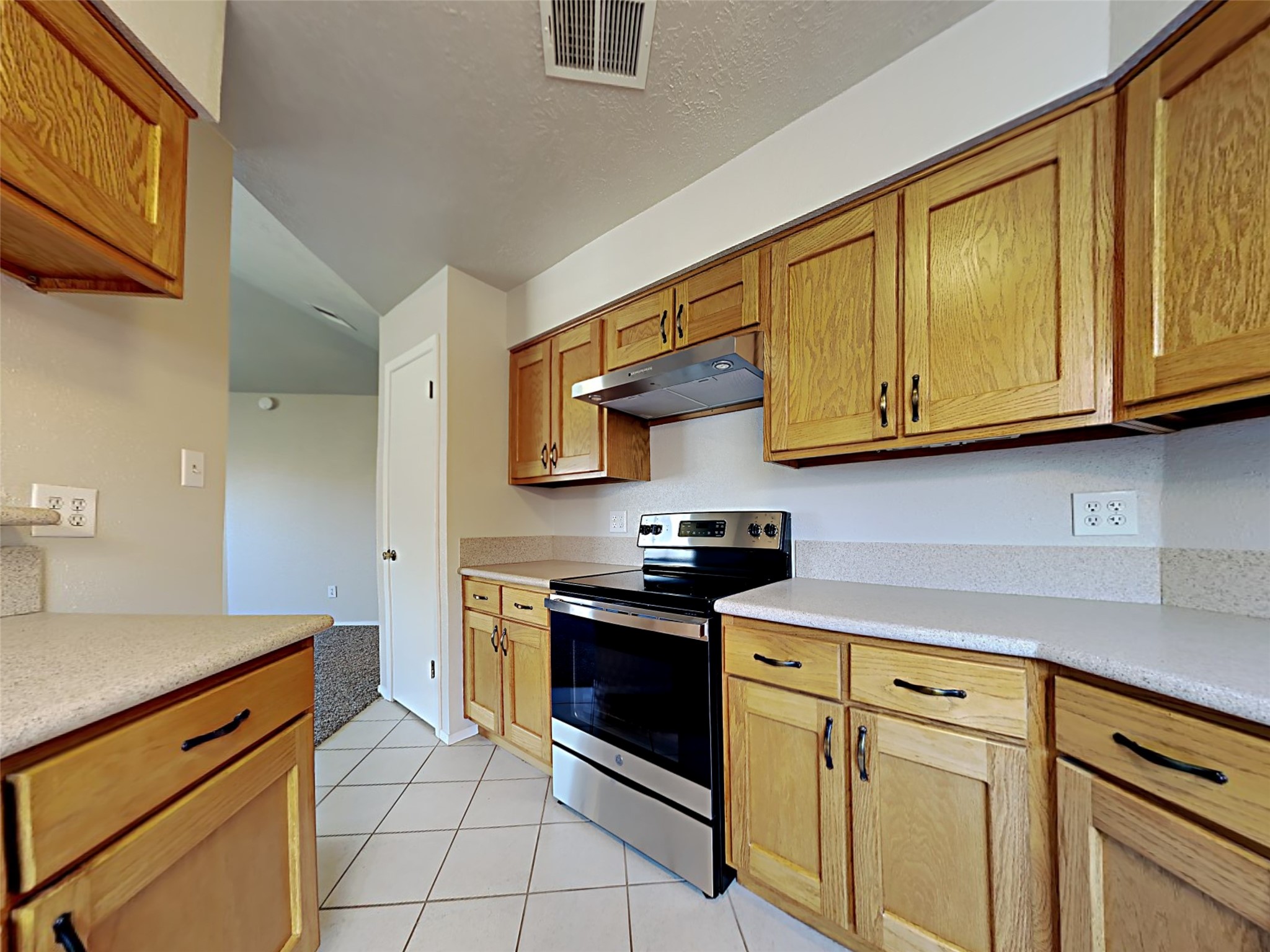 14919 Wainsfield Lane Channelview, TX 77530 - Photo 4 of 17 a kitchen with stainless steel appliances granite countertop a sink and cabinets