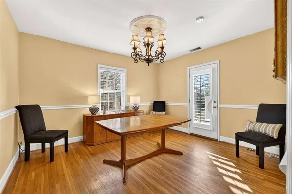 a bedroom with furniture window and ceiling fan