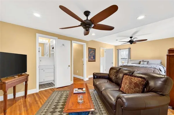 a view of an entryway with wooden floor and windows