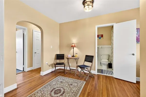 a view of a chair and table in the garden