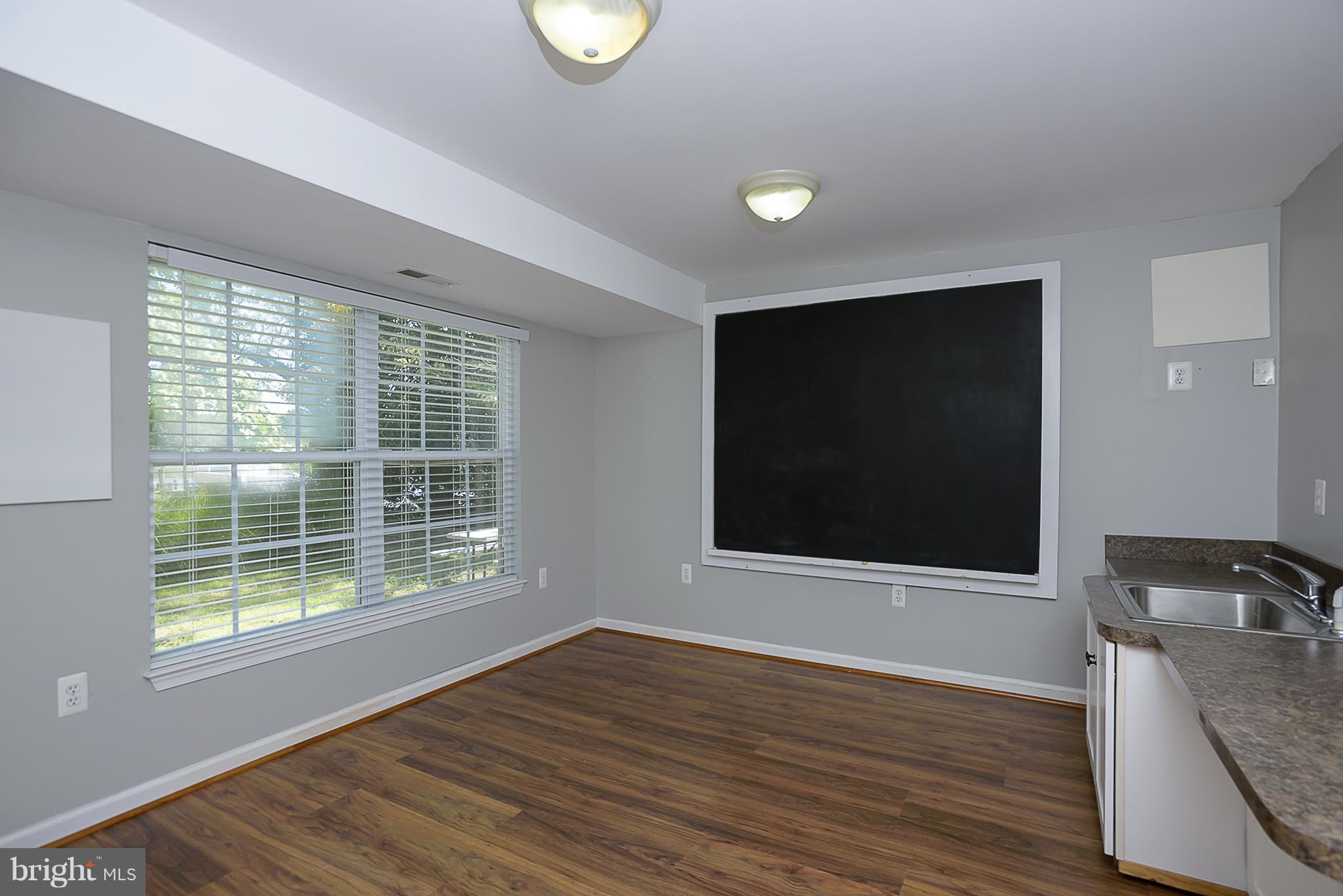 8216 Riverside Drive Pasadena, MD 21122 - Photo 14 of 30 Home office, playroom or 6th bedroom - your choice