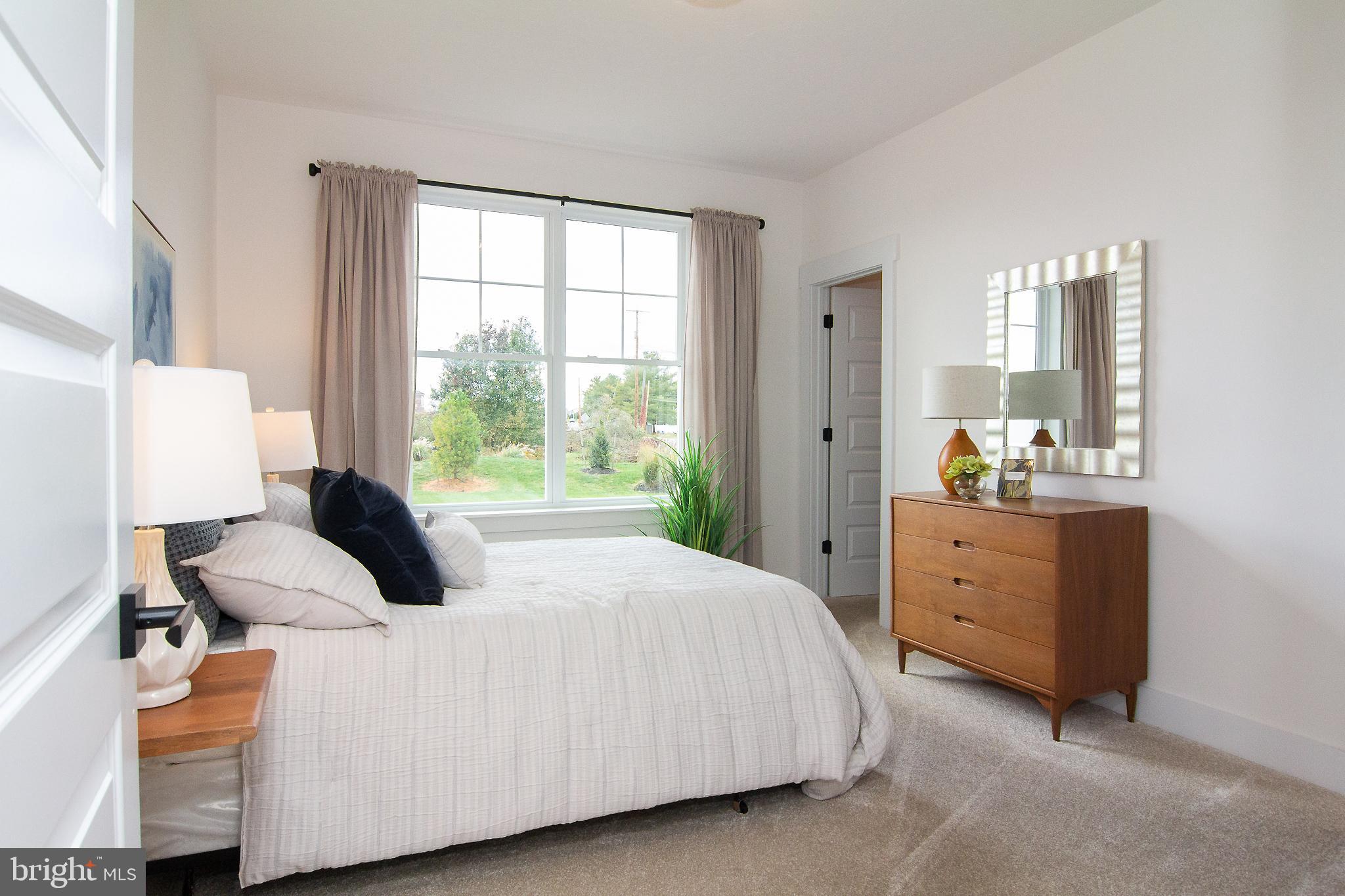 3913 St Pauls Road Manchester, MD 21102 - Photo 20 of 38 a bedroom with a bed and a window