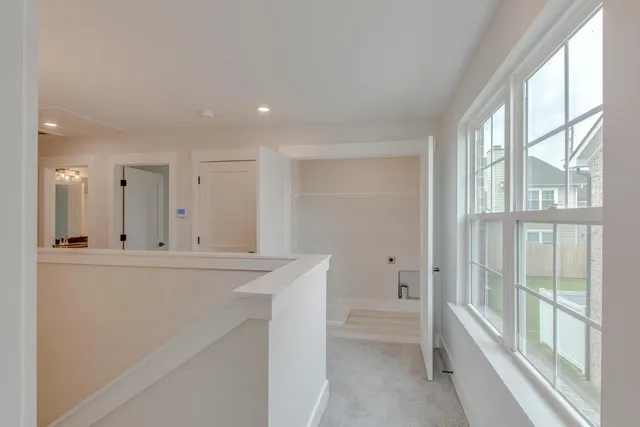 a view of open kitchen with granite countertop cabinets