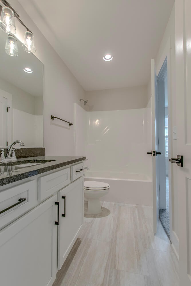 224 Tyler Cornerstone Trail Smyrna, TN 37167 - Photo 26 of 43 a bathroom with a sink a toilet and tub