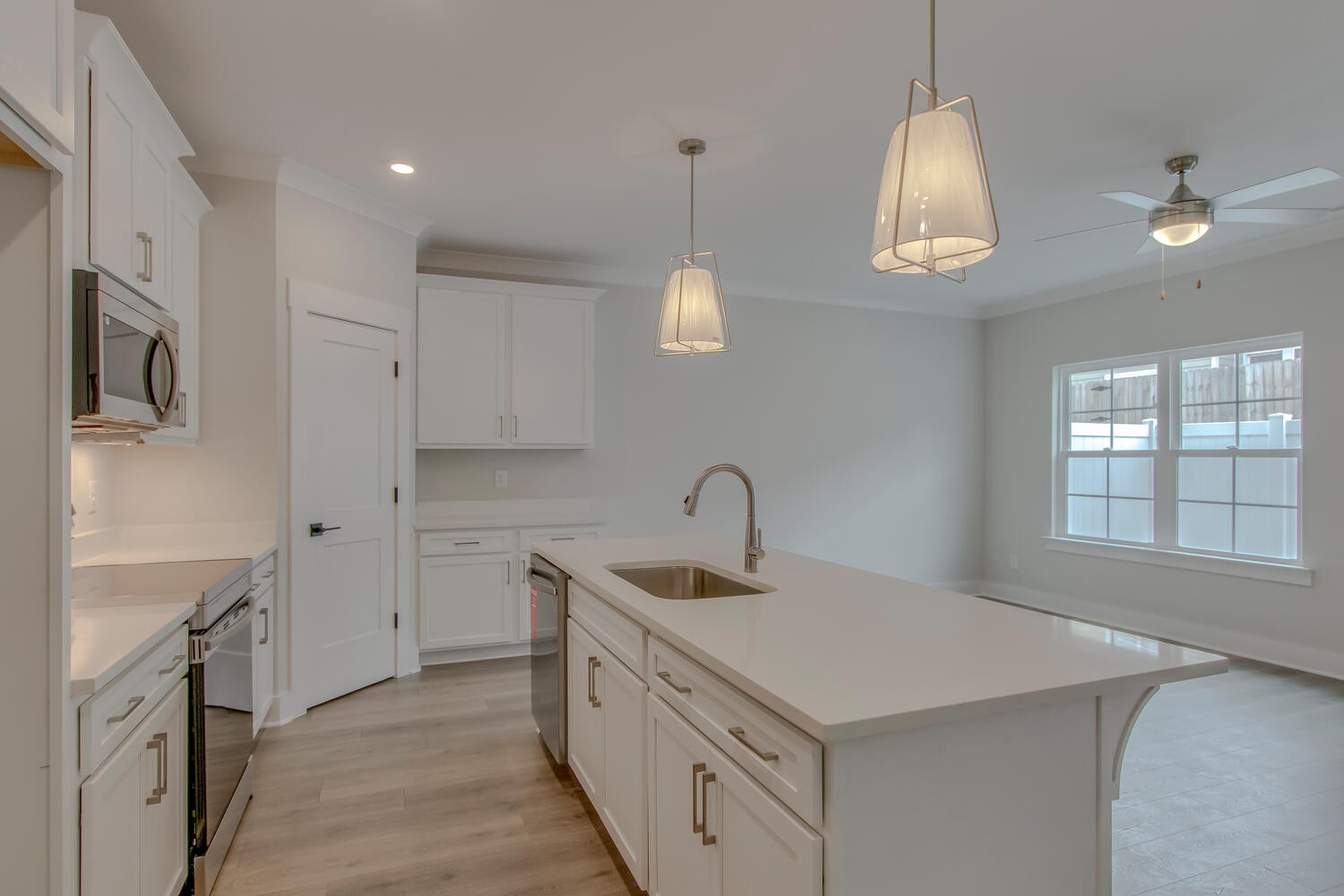 224 Tyler Cornerstone Trail Smyrna, TN 37167 - Photo 33 of 43 a kitchen with a sink dishwasher a stove and a refrigerator with wooden floor